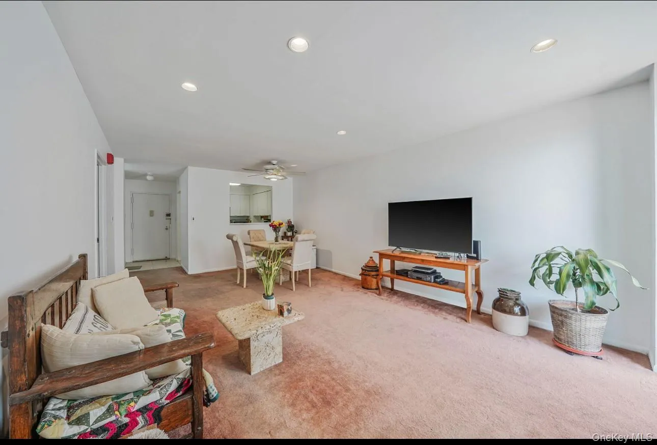 Carpeted living area featuring recessed lighting and ceiling fan Carpeted living area featuring recessed lighting and ceiling fan