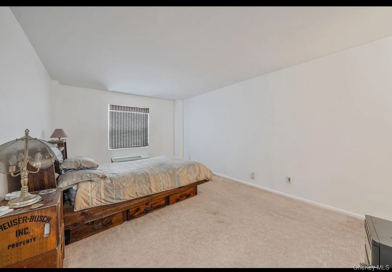 Bedroom with carpet flooring and baseboards Bedroom with carpet flooring and baseboards