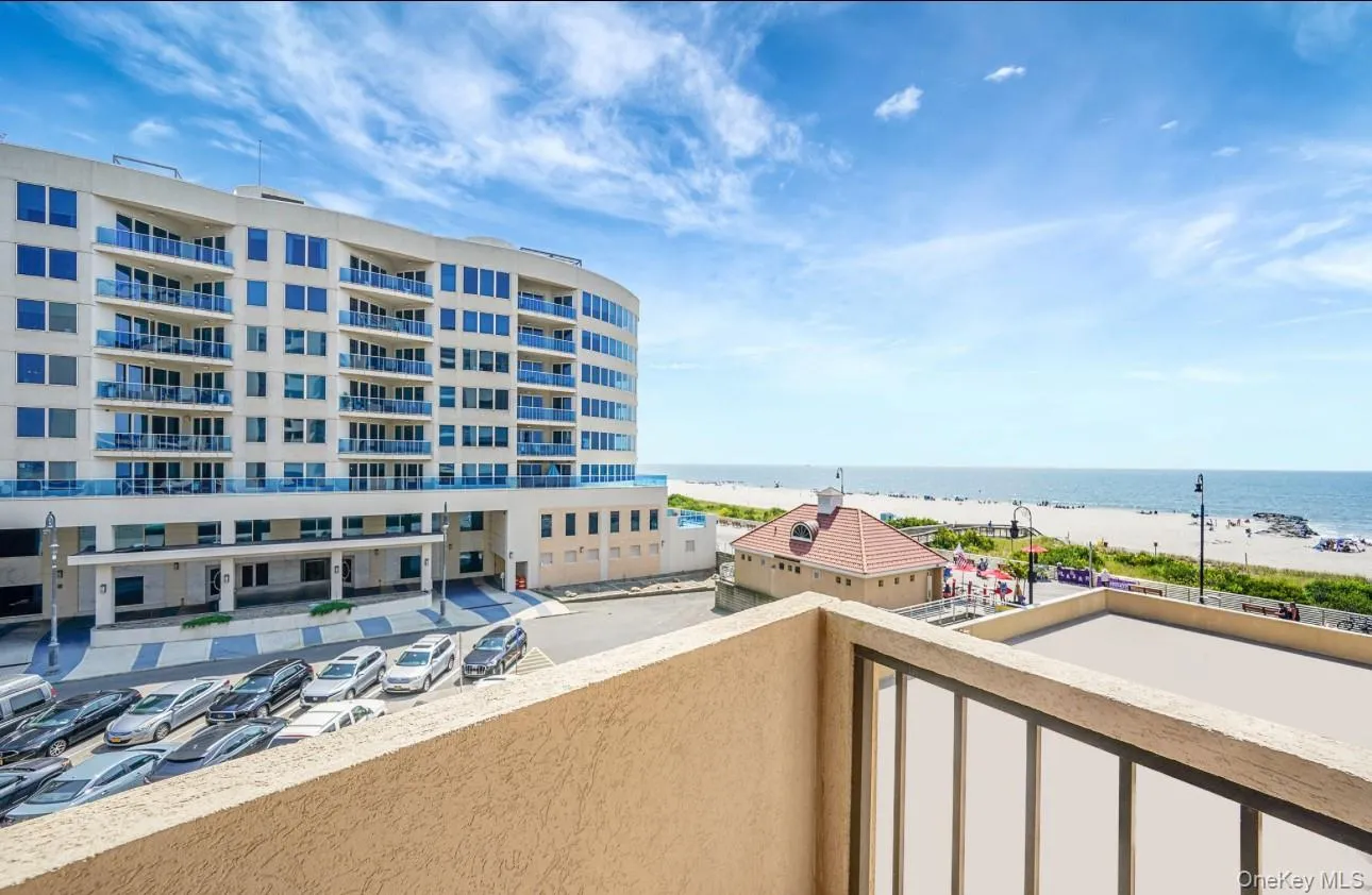 Balcony with view of water and beach Balcony with view of water and beach