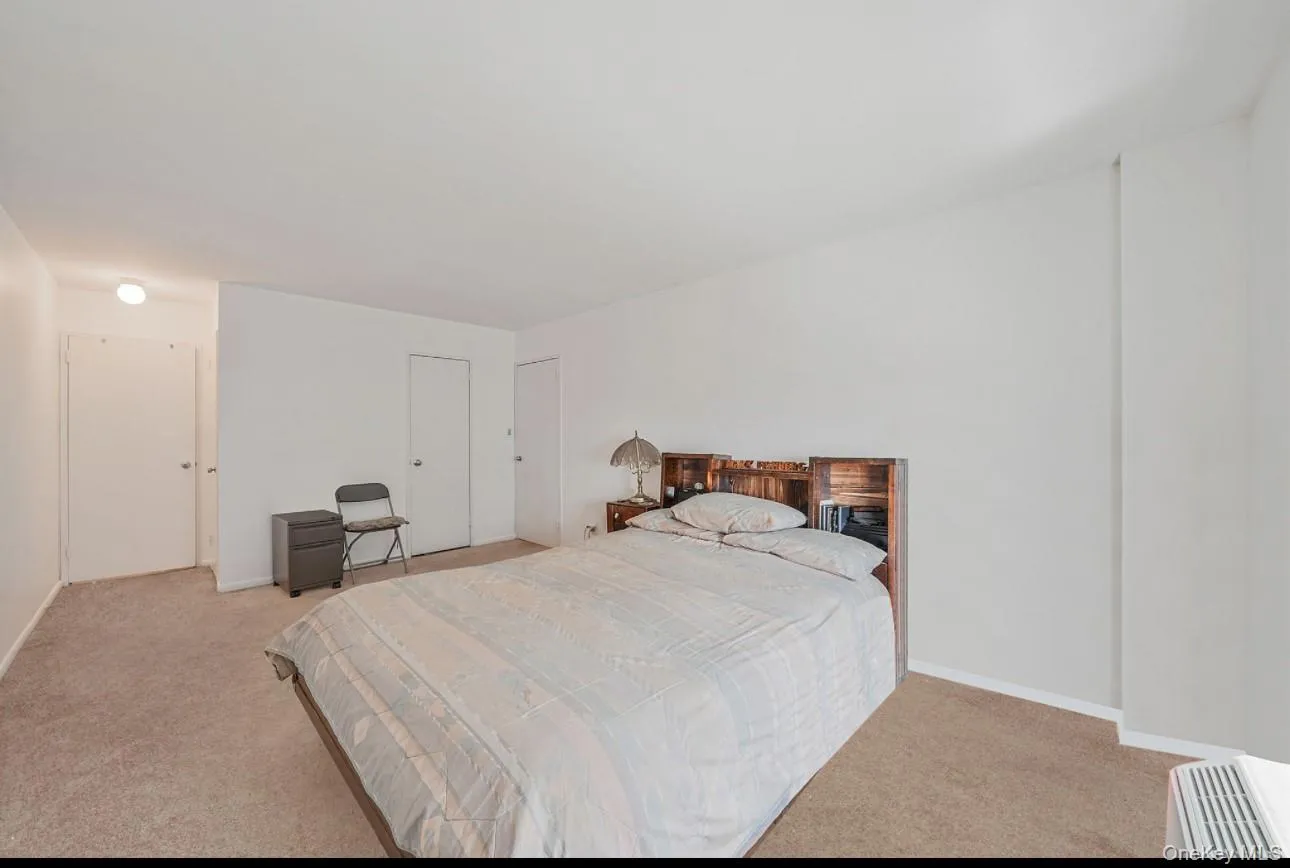 Bedroom with light carpet Bedroom with light carpet
