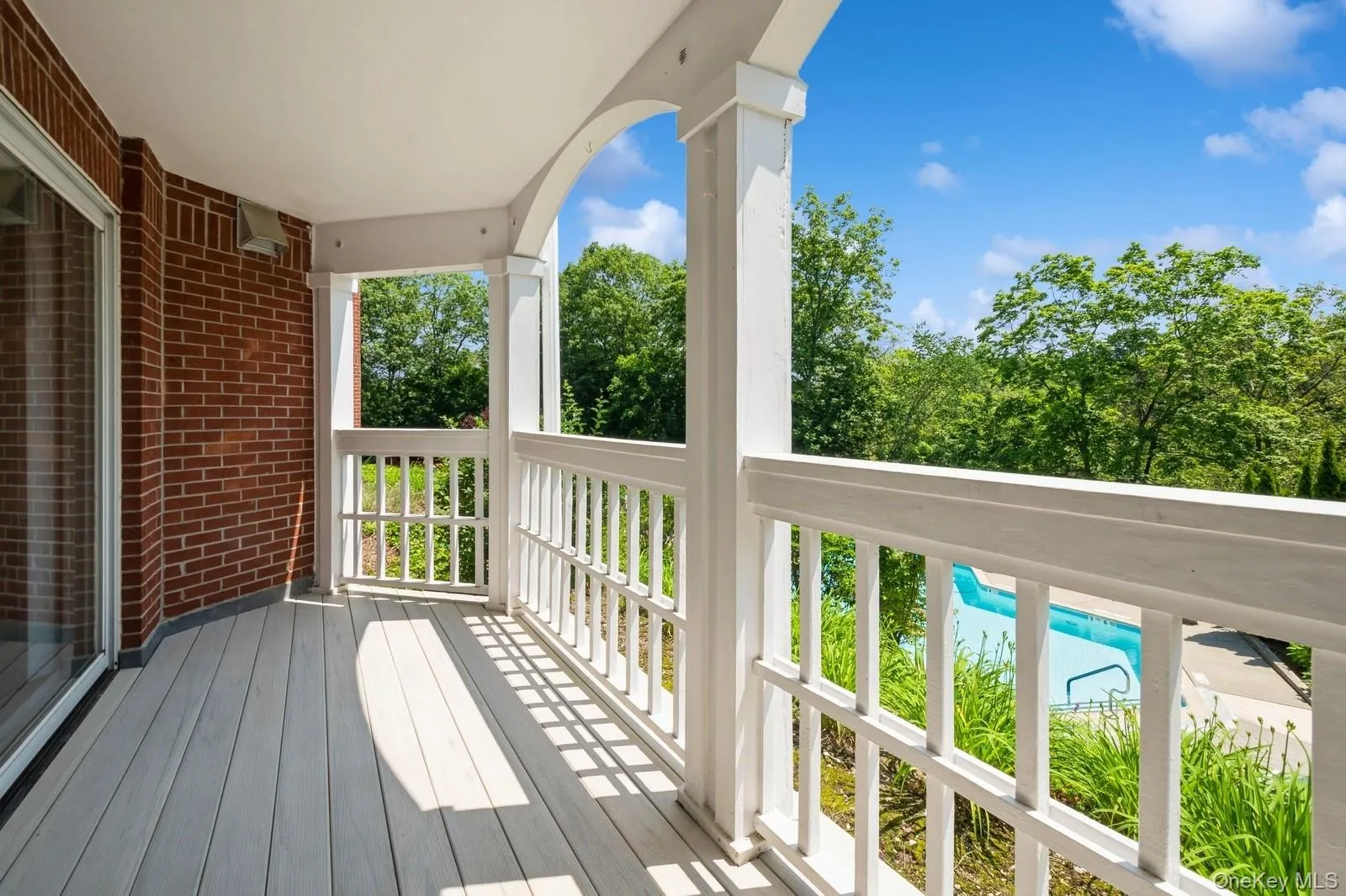 View of large private trex deck overlooking pool View of large private trex deck overlooking pool