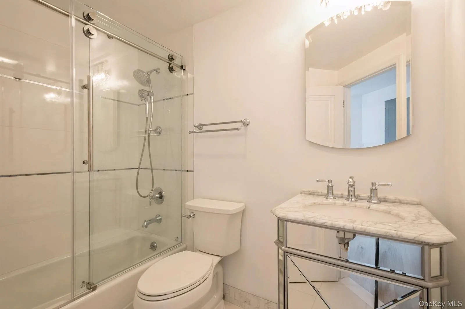 Bathroom with enclosed tub / shower combo and vanity Bathroom with enclosed tub / shower combo and vanity