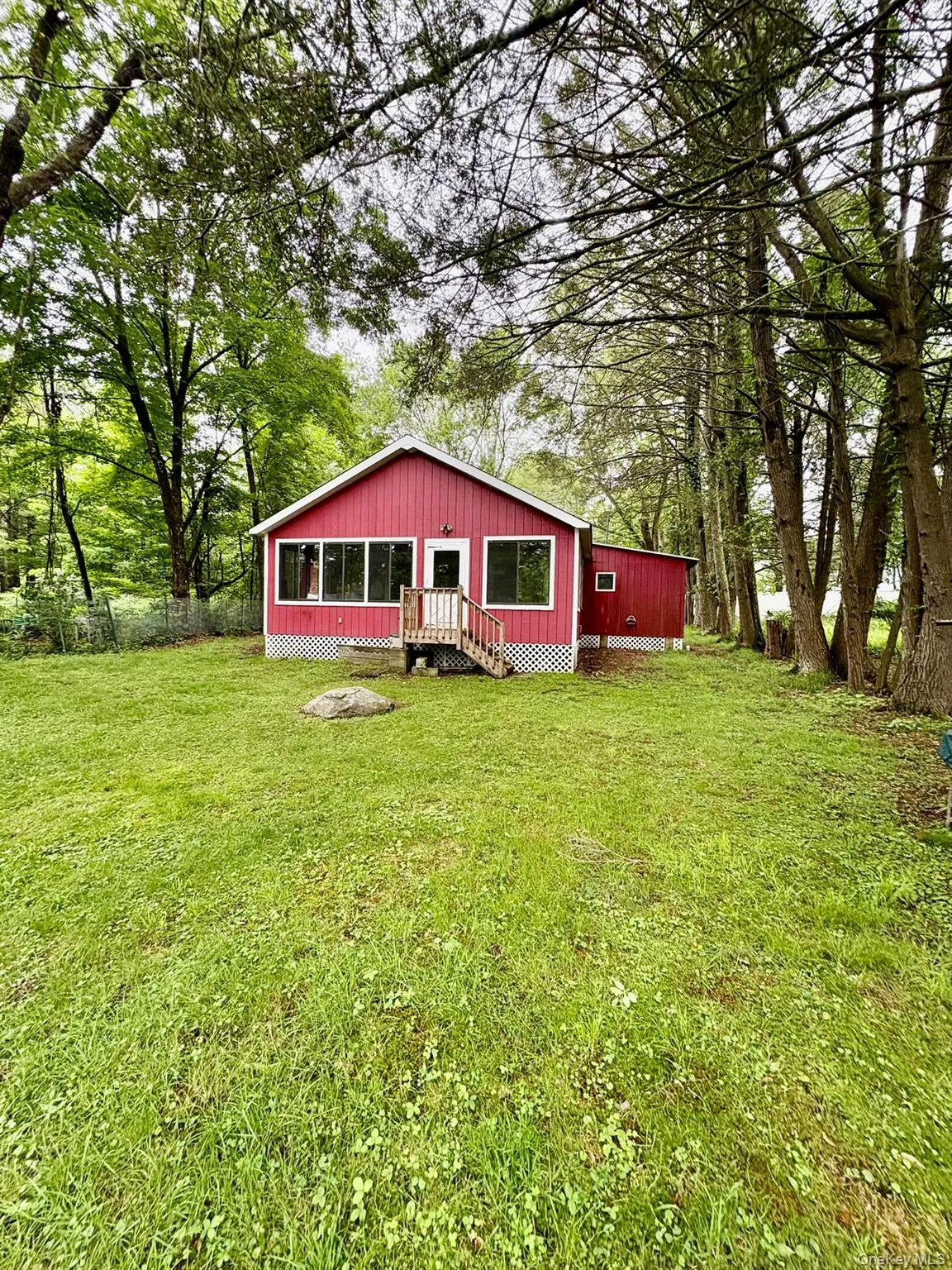 Rear view of house with a yard Rear view of house with a yard