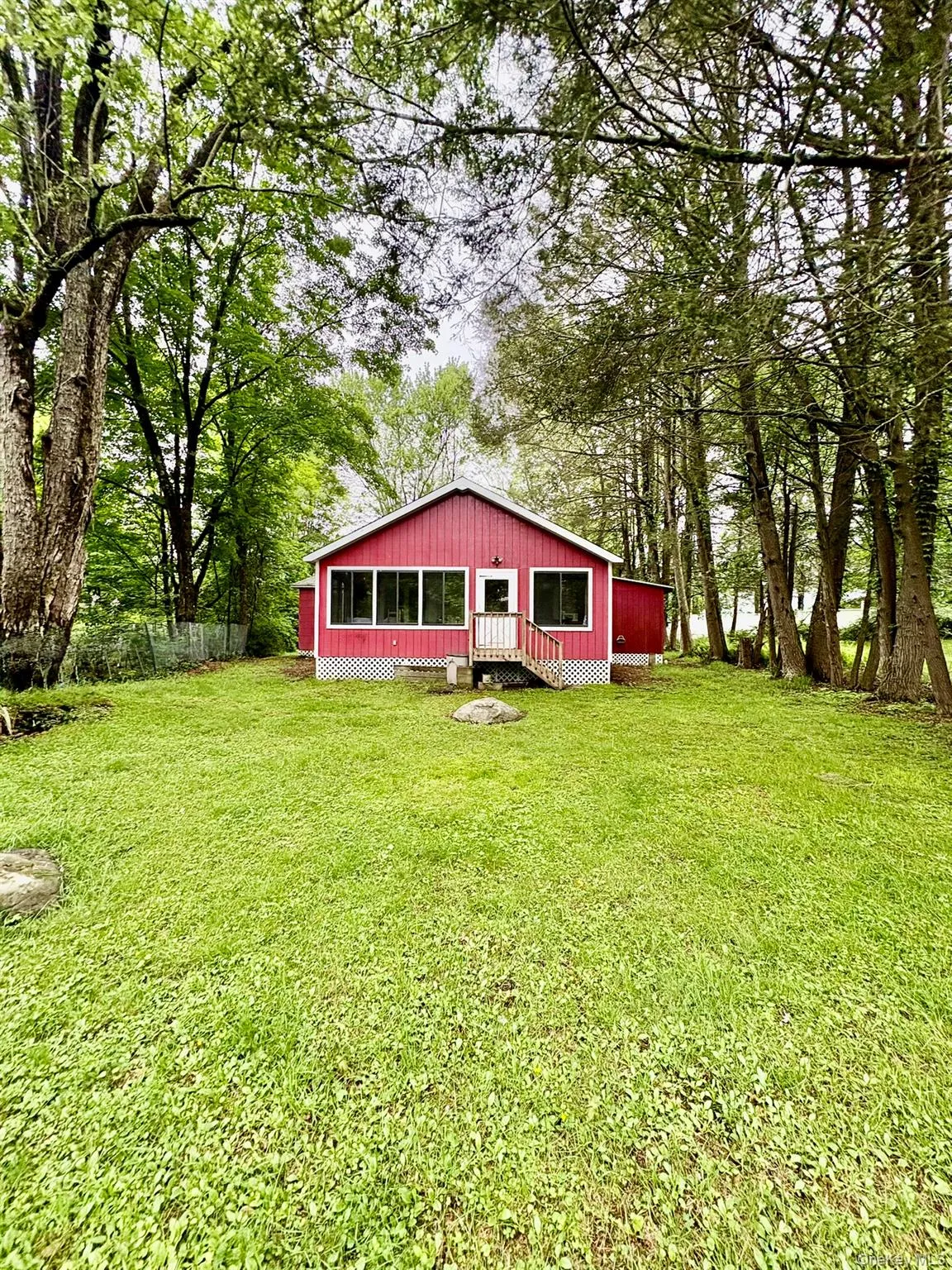 Back of house with a lawn Back of house with a lawn