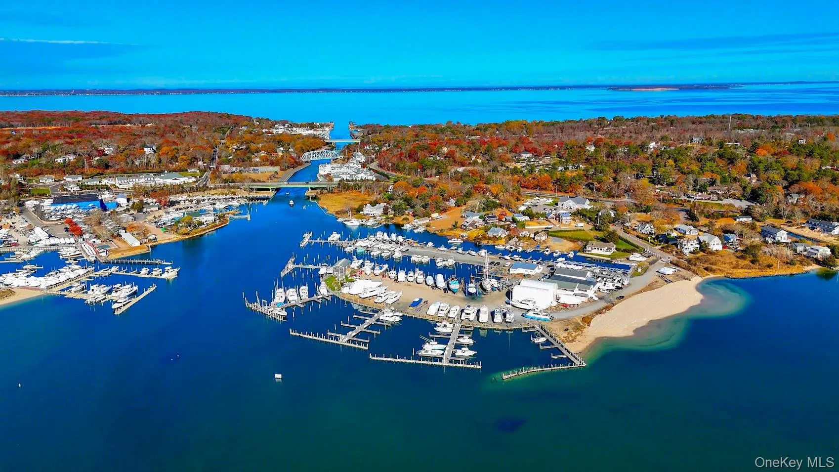 Aerial view of numerous boat docks and a nearby body of water Aerial view of numerous boat docks and a nearby body of water