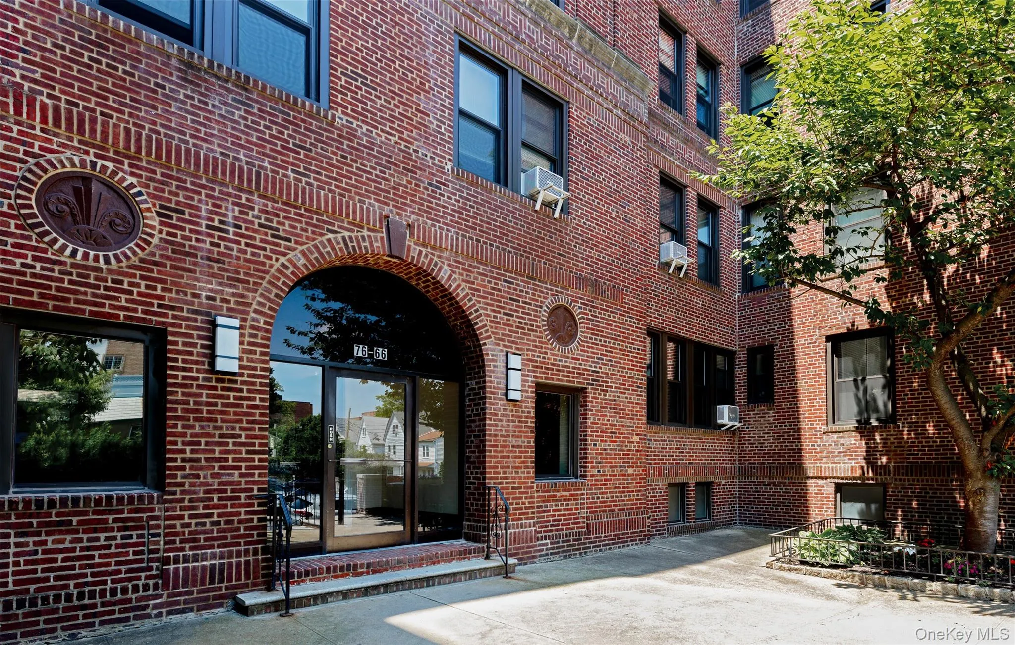 Property entrance featuring brick siding Property entrance featuring brick siding