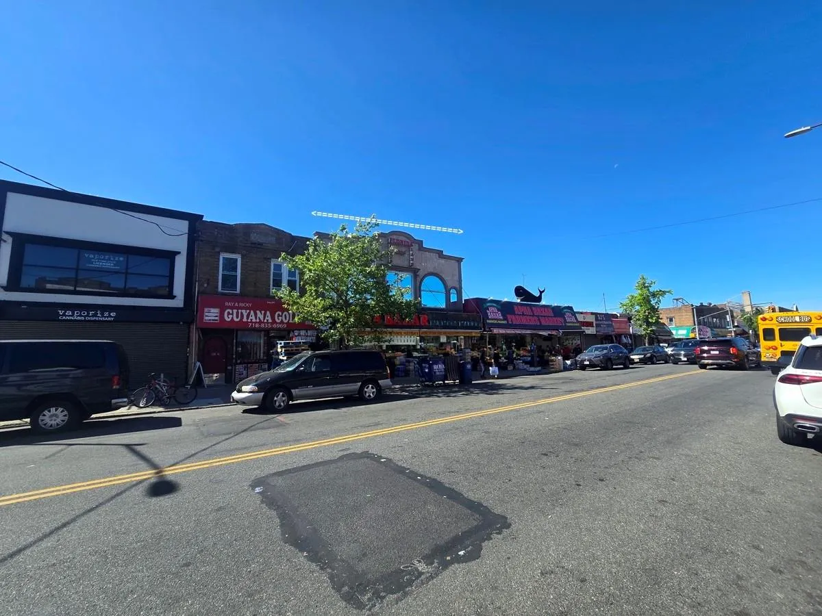 View of asphalt street featuring street lights View of asphalt street featuring street lights