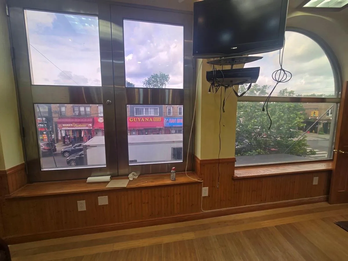 Detailed view of wood finished floors, wooden walls, and a wainscoted wall Detailed view of wood finished floors, wooden walls, and a wainscoted wall
