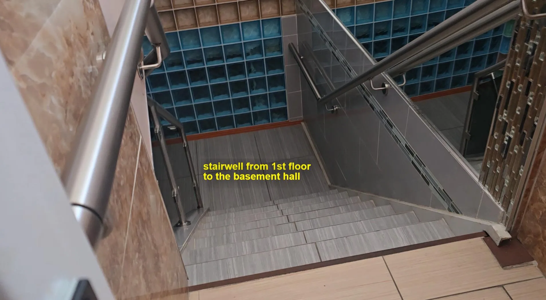 Stairway featuring tile patterned floors Stairway featuring tile patterned floors