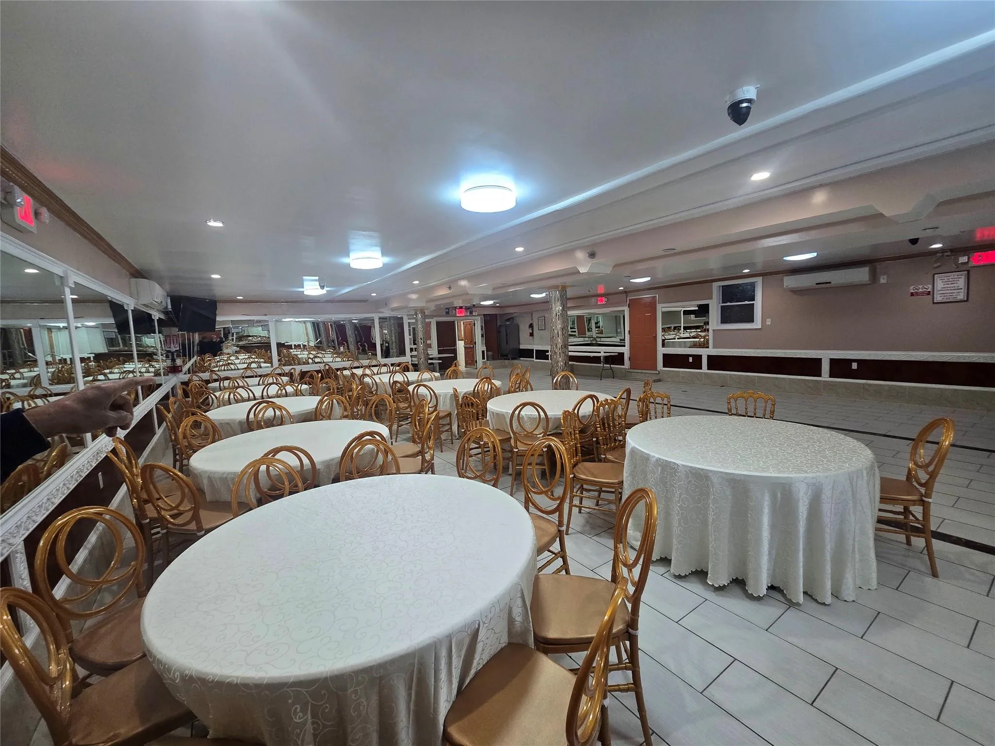 Dining room featuring tile patterned flooring, an AC wall unit, and recessed lighting Dining room featuring tile patterned flooring, an AC wall unit, and recessed lighting