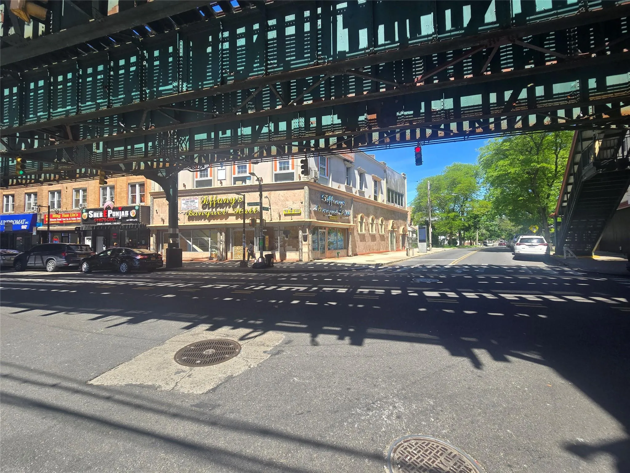View of asphalt road featuring sidewalks View of asphalt road featuring sidewalks