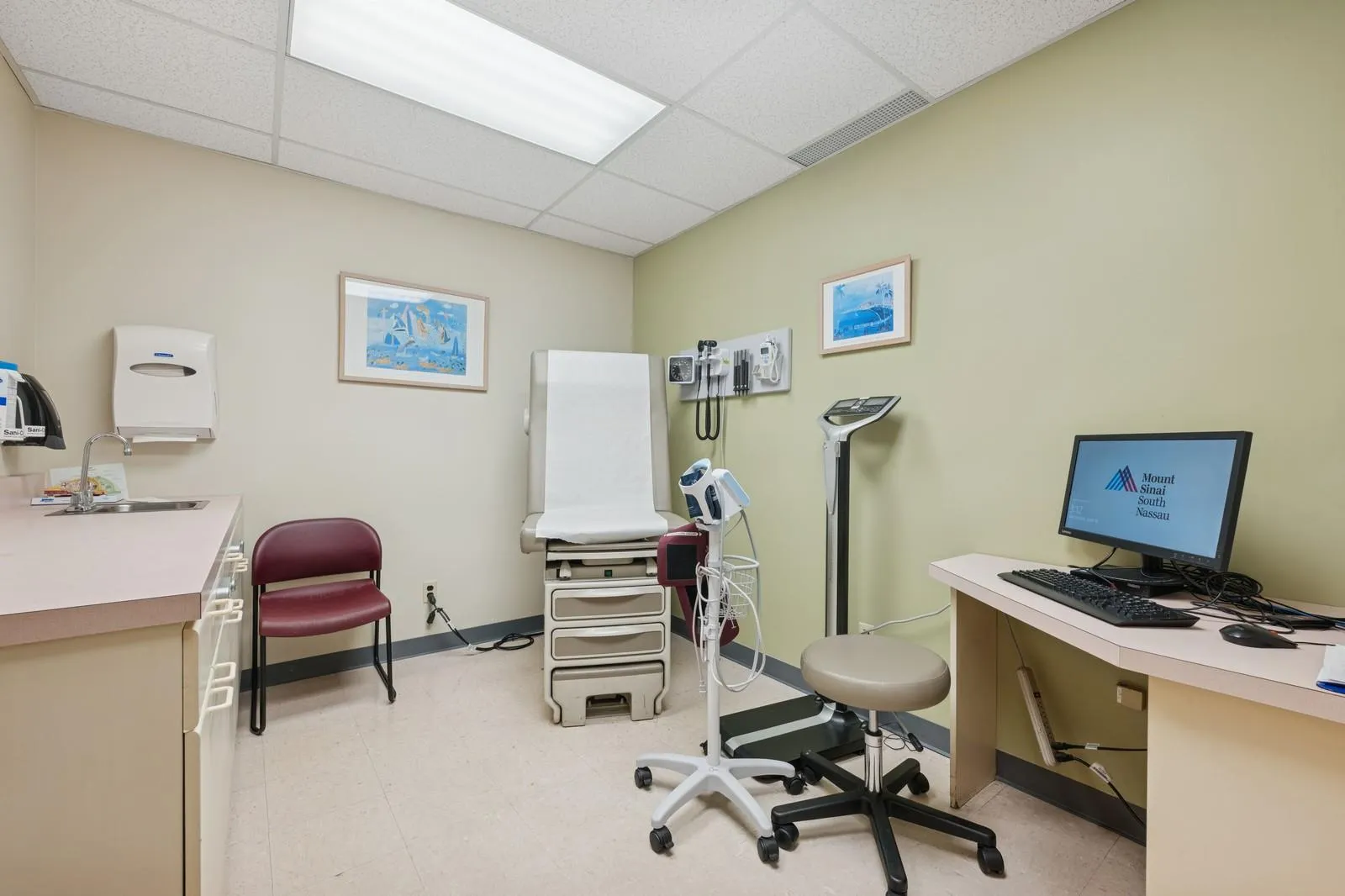 Office area featuring a sink and a drop ceiling Office area featuring a sink and a drop ceiling