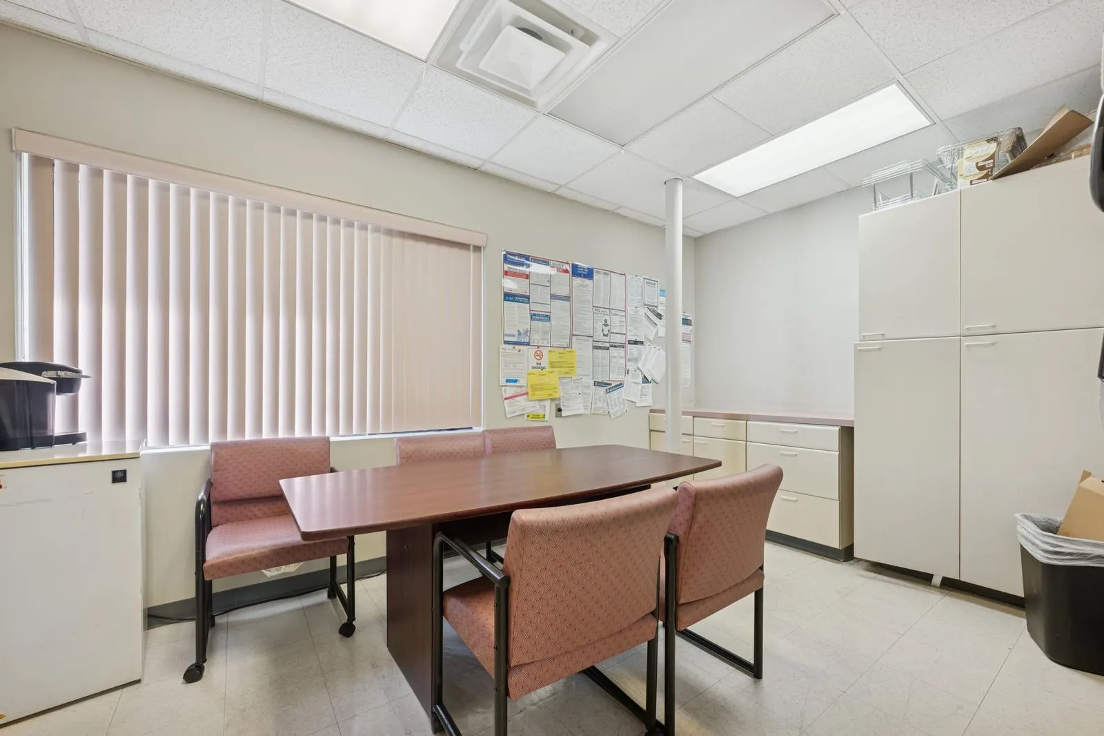 Dining area featuring a paneled ceiling and light floors Dining area featuring a paneled ceiling and light floors