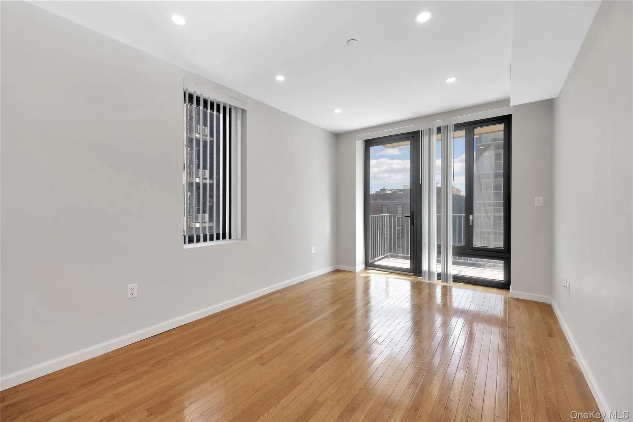 Spare room with baseboards, light wood-type flooring, and recessed lighting Spare room with baseboards, light wood-type flooring, and recessed lighting