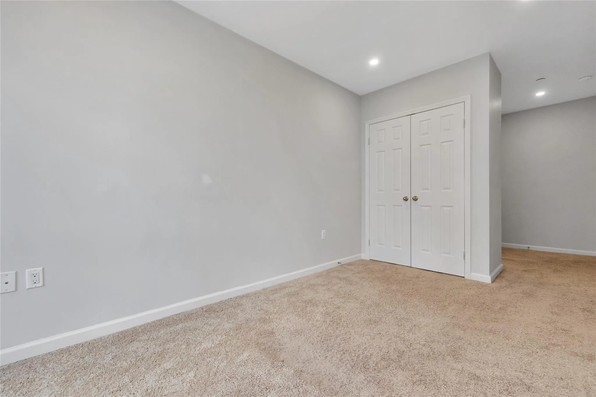 Unfurnished bedroom featuring a closet, recessed lighting, baseboards, and carpet floors Unfurnished bedroom featuring a closet, recessed lighting, baseboards, and carpet floors