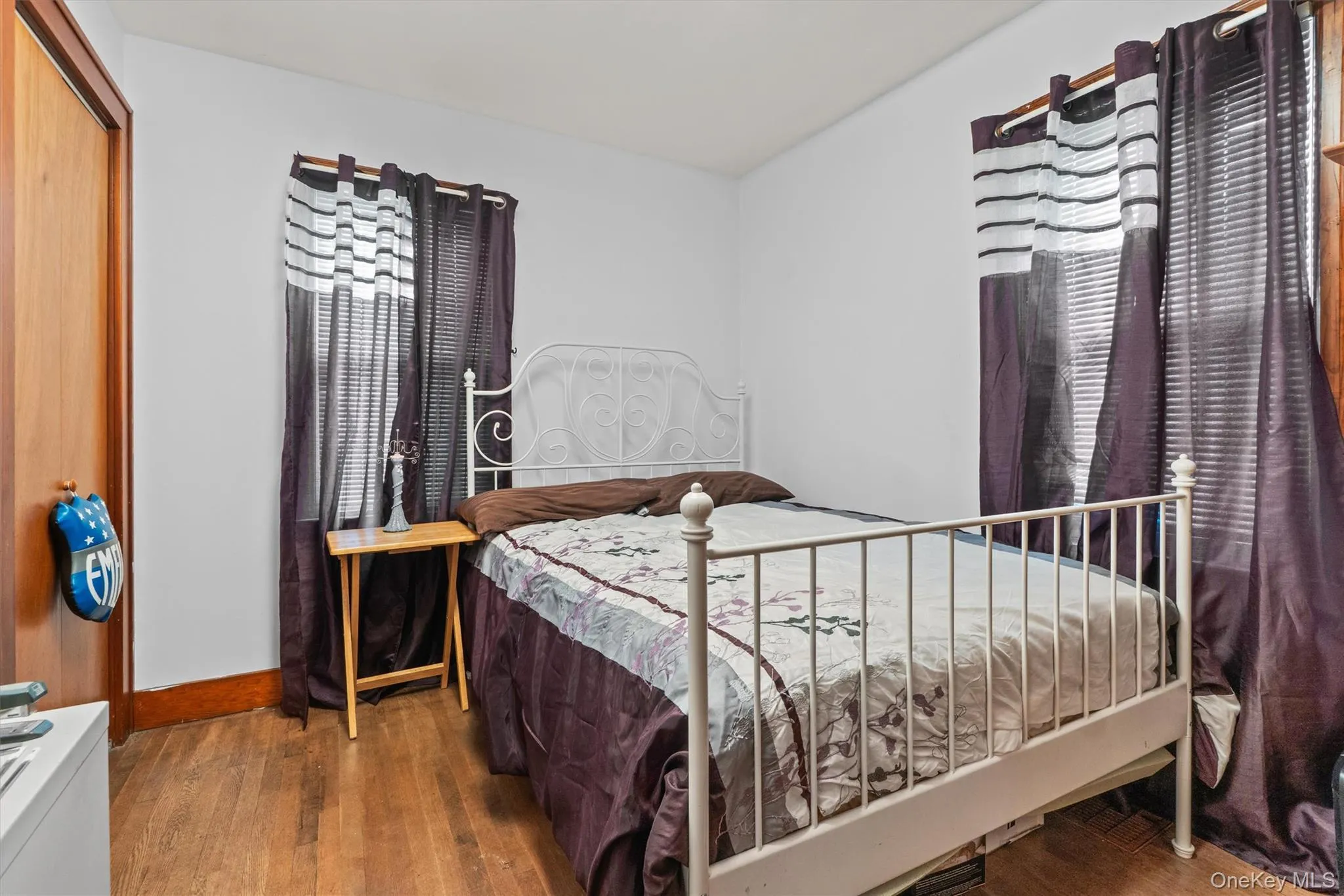 Bedroom with wood-type flooring. Bedroom with wood-type flooring.
