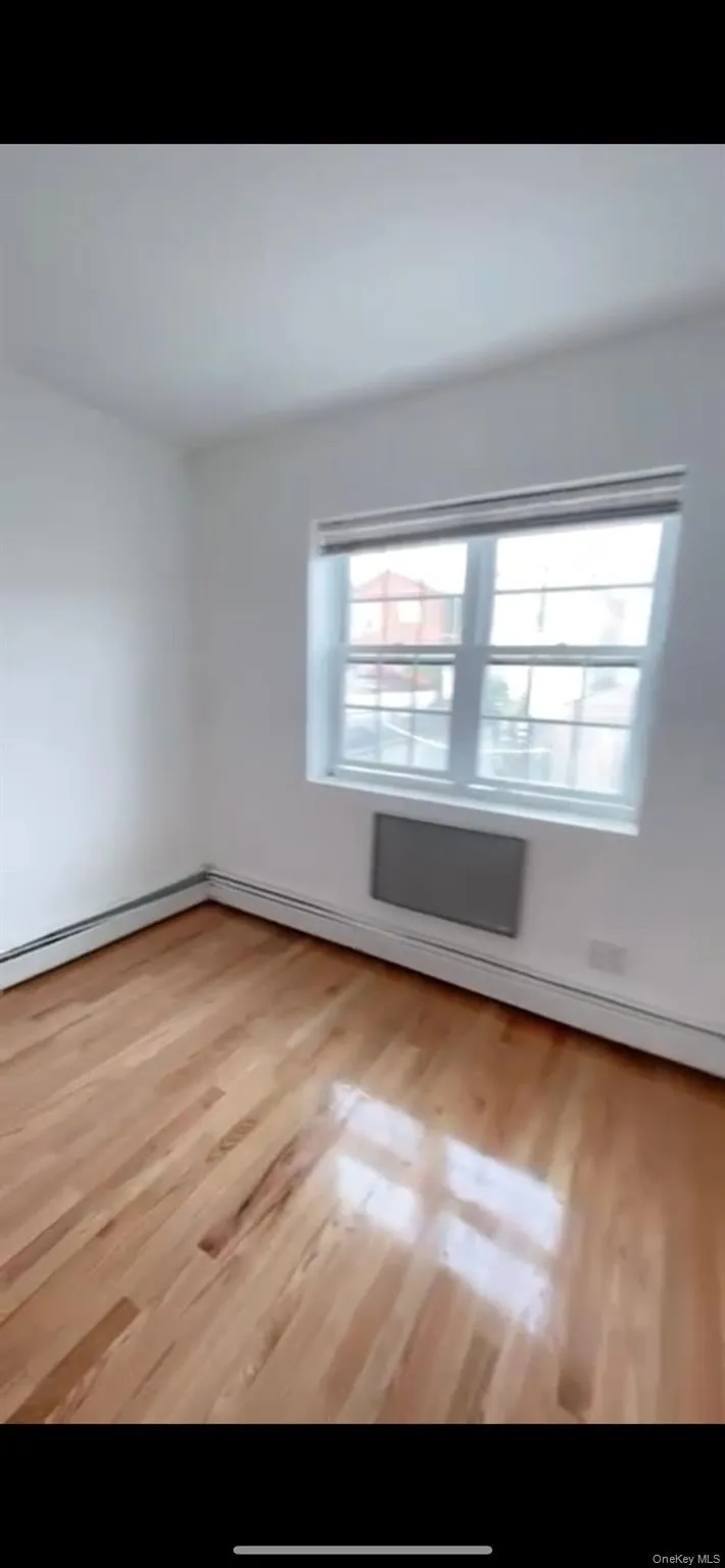 Spare room with wood finished floors Spare room with wood finished floors