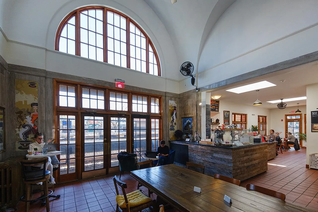 Dining space featuring tile patterned flooring, a high ceiling, french doors, plenty of natural light, and radiator heating unit Dining space featuring tile patterned flooring, a high ceiling, french doors, plenty of natural light, and radiator heating unit