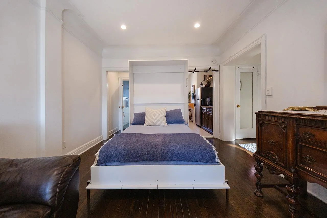 Bedroom with wood finished floors and recessed lighting Bedroom with wood finished floors and recessed lighting