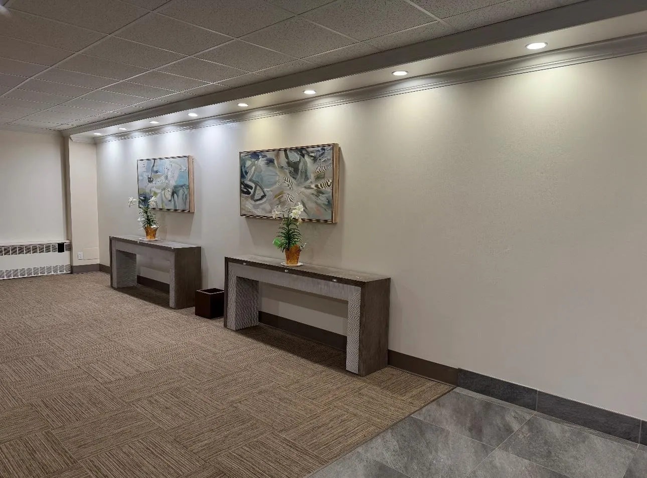 Corridor with radiator, baseboards, and recessed lighting Corridor with radiator, baseboards, and recessed lighting