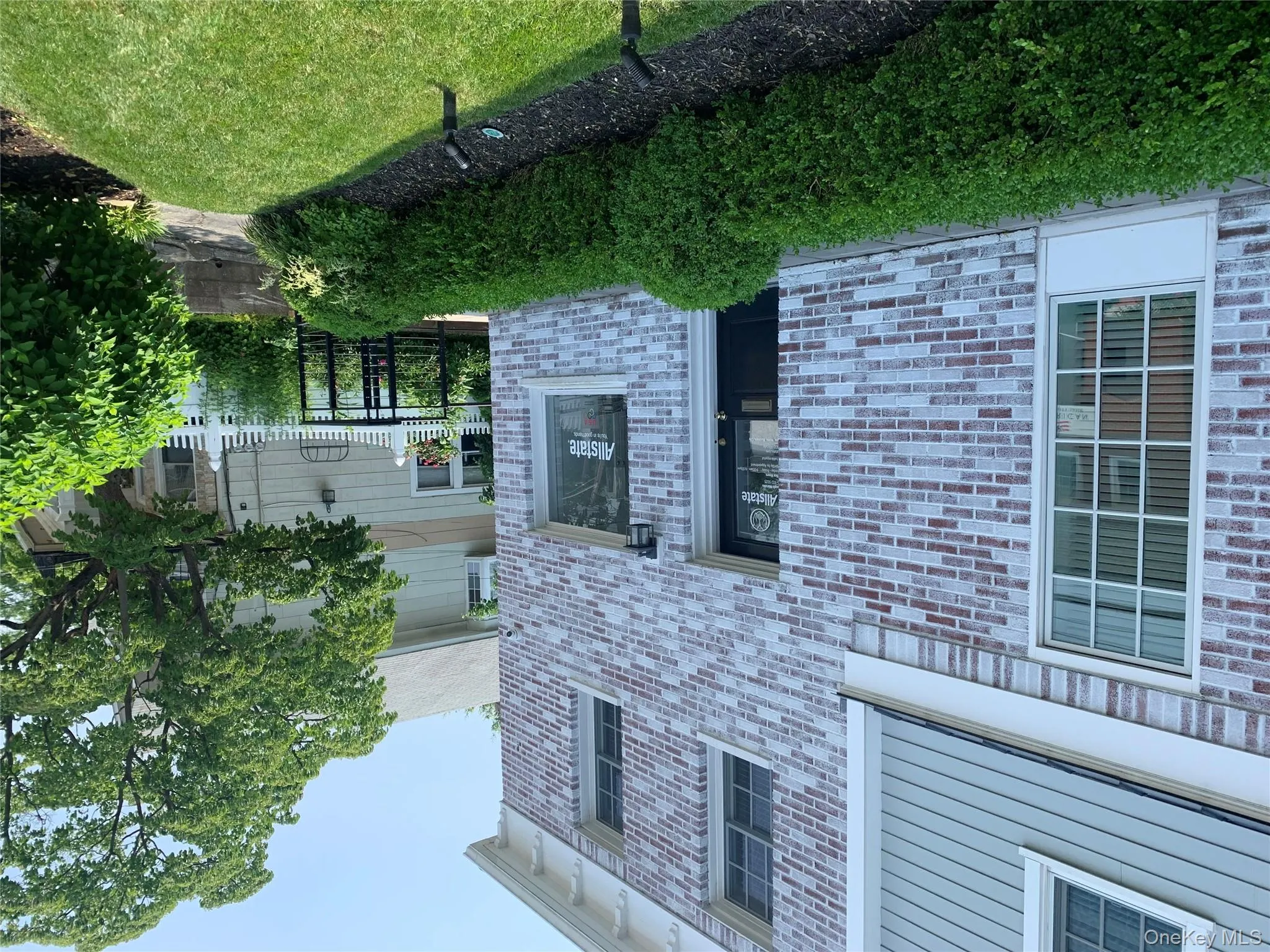 Property entrance with brick siding Property entrance with brick siding