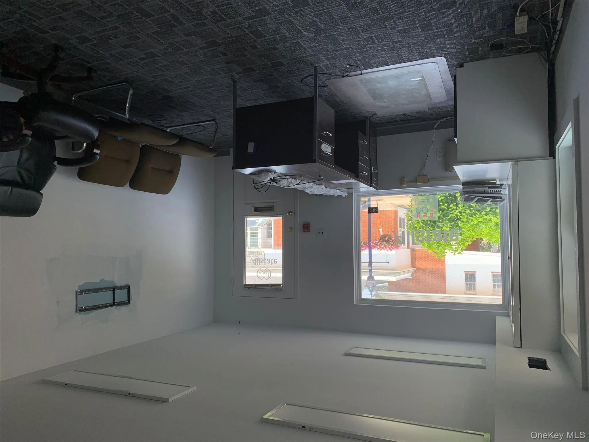 Home office with carpet flooring and plenty of natural light Home office with carpet flooring and plenty of natural light