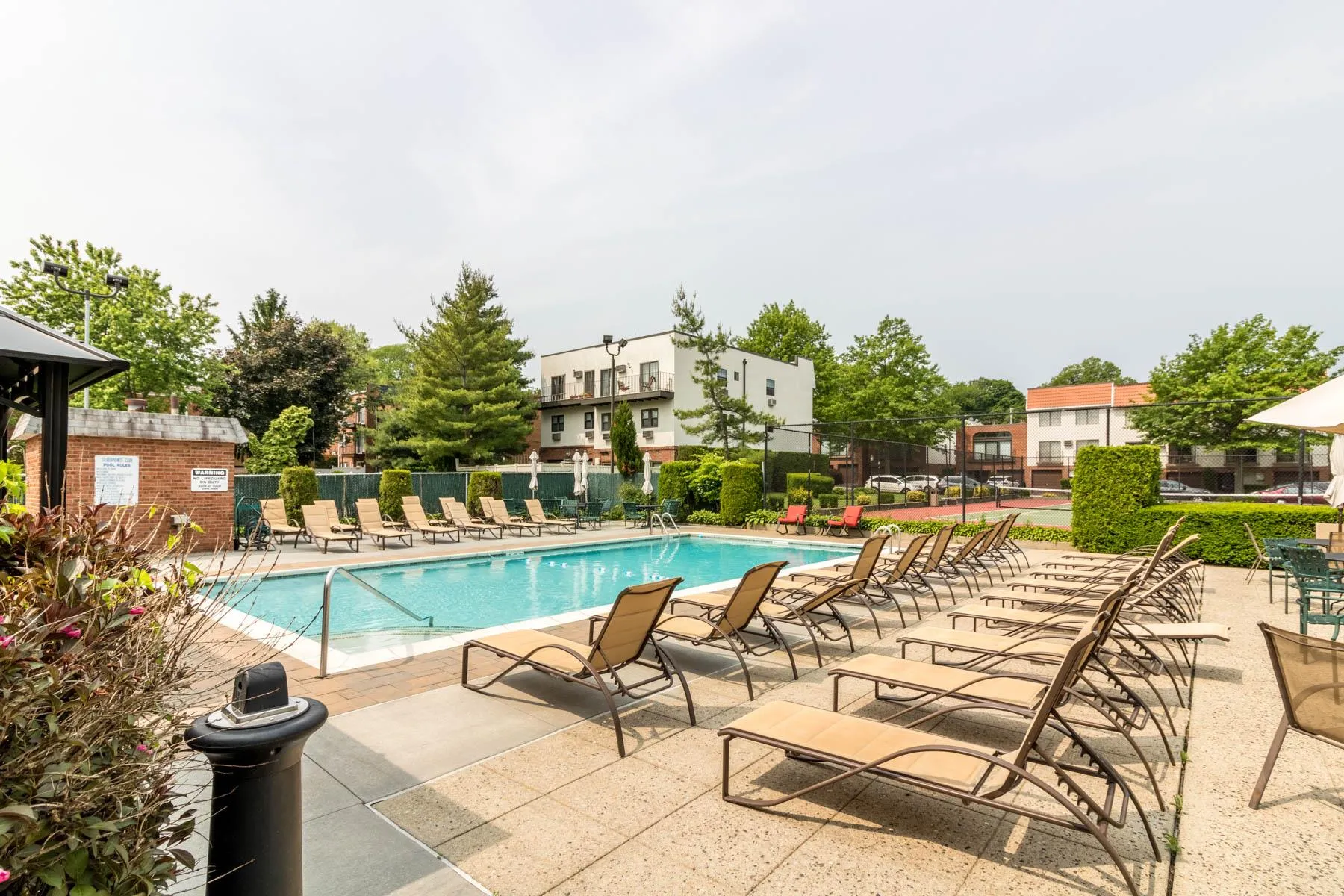 Community pool with a patio area Community pool with a patio area