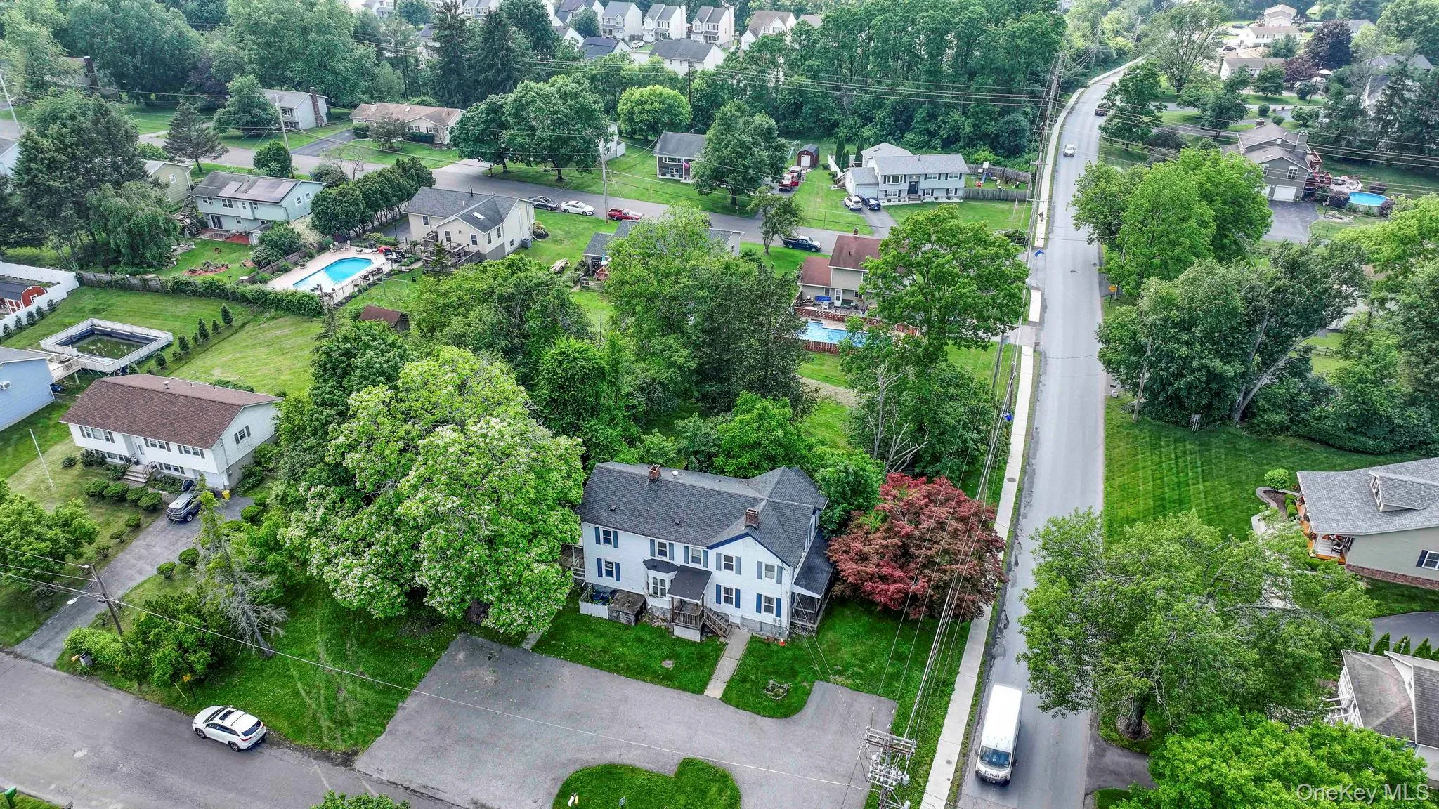 Aerial view of residential area with a tree filled landscape Aerial view of residential area with a tree filled landscape