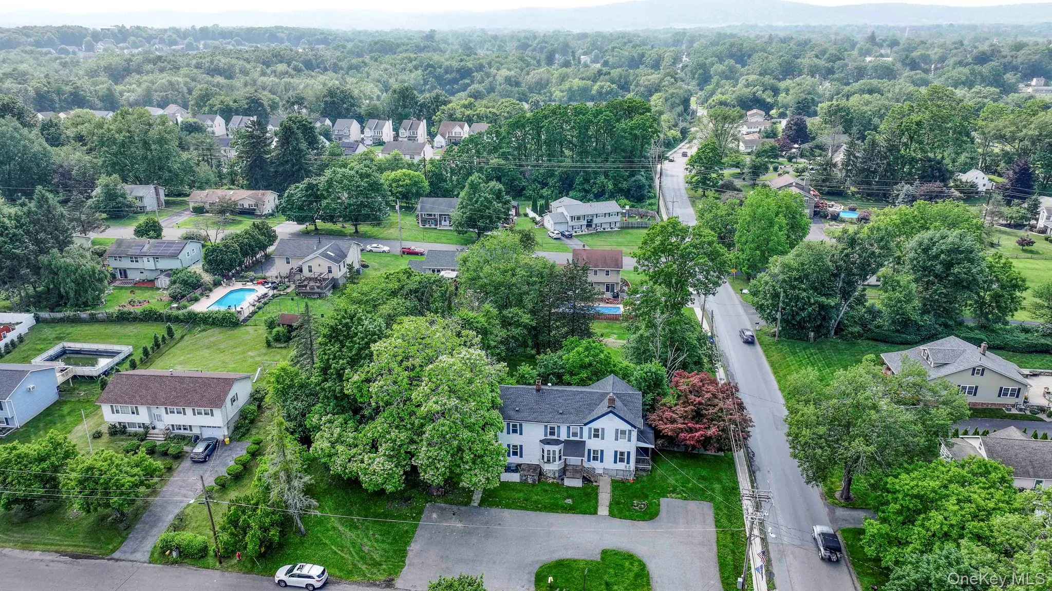 Aerial overview of property's location with nearby suburban area Aerial overview of property's location with nearby suburban area