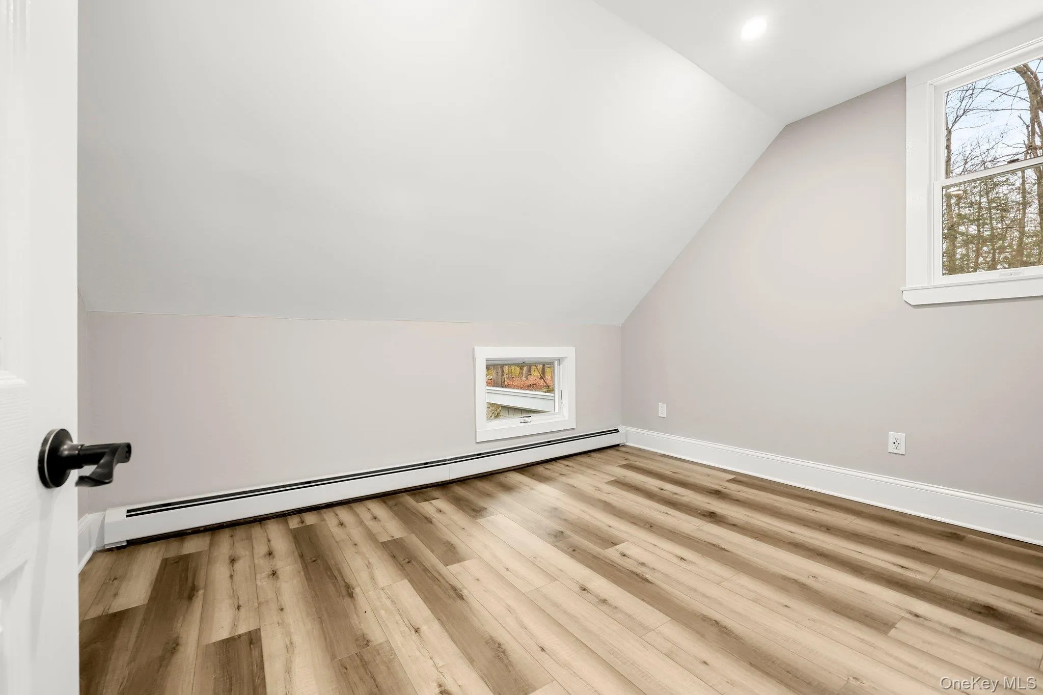 Bedroom with lofted ceiling Bedroom with lofted ceiling