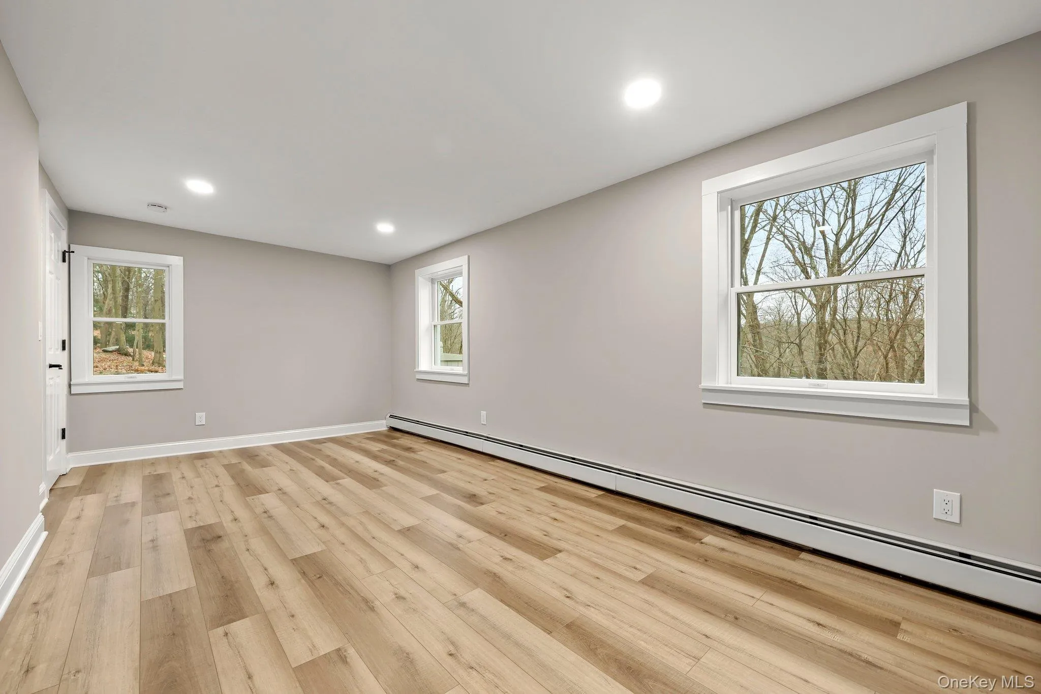 Study featuring  wood-style flooring, baseboards, and recessed lighting Study featuring  wood-style flooring, baseboards, and recessed lighting