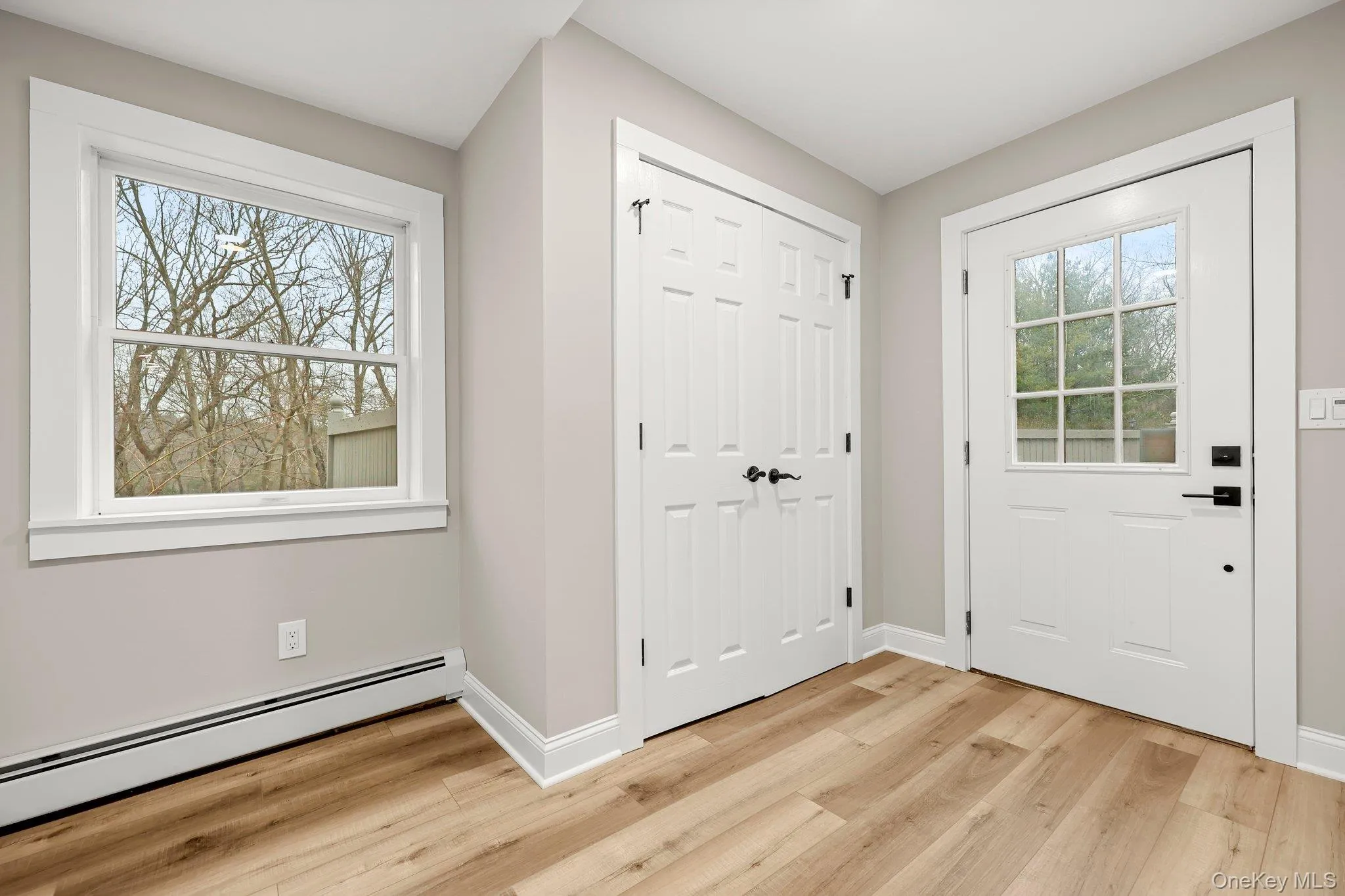 Additional Entryway/Mud Room featuring a  light wood finished floor, ample closets Additional Entryway/Mud Room featuring a  light wood finished floor, ample closets