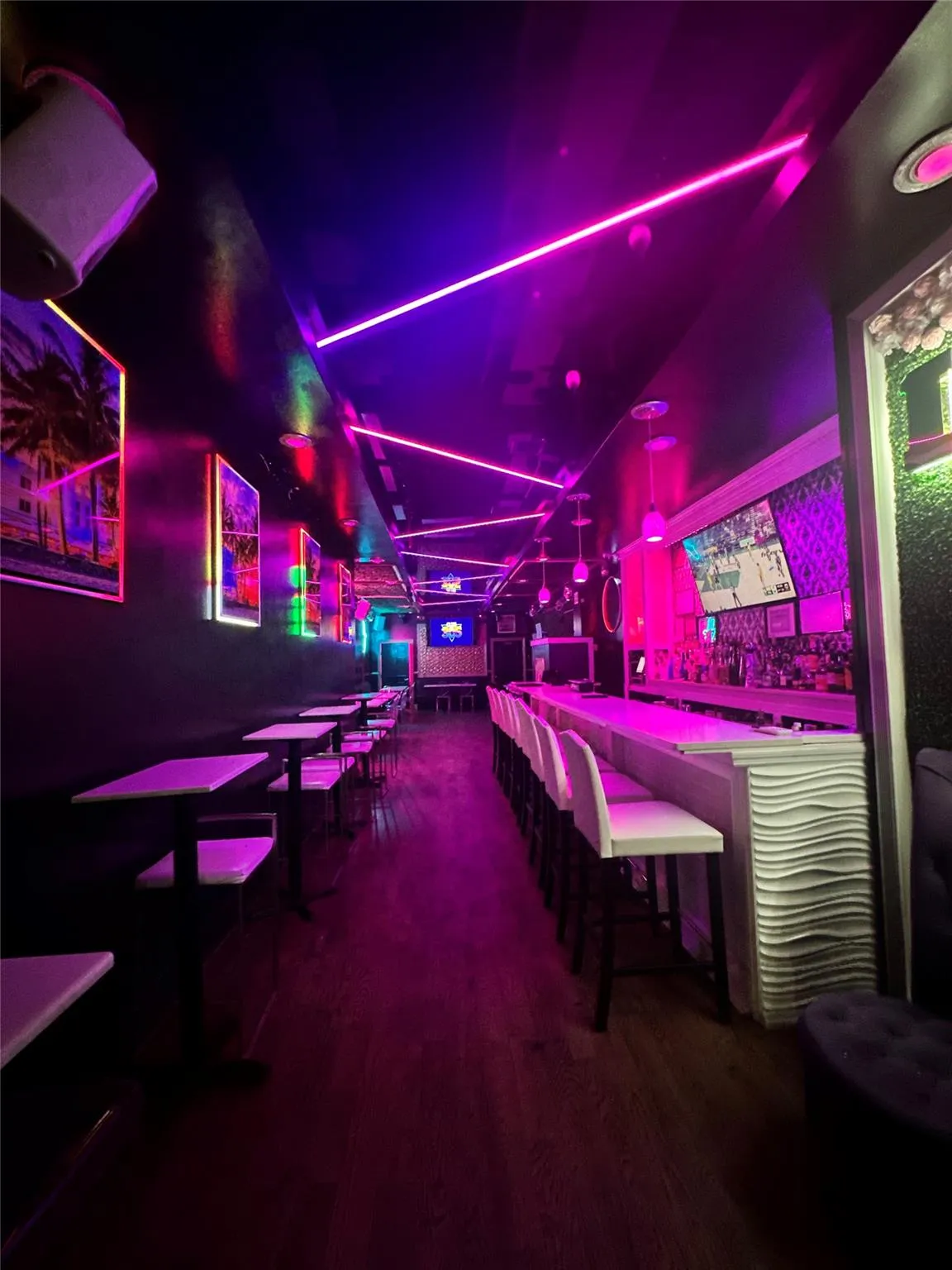 Game room with wood finished floors Game room with wood finished floors