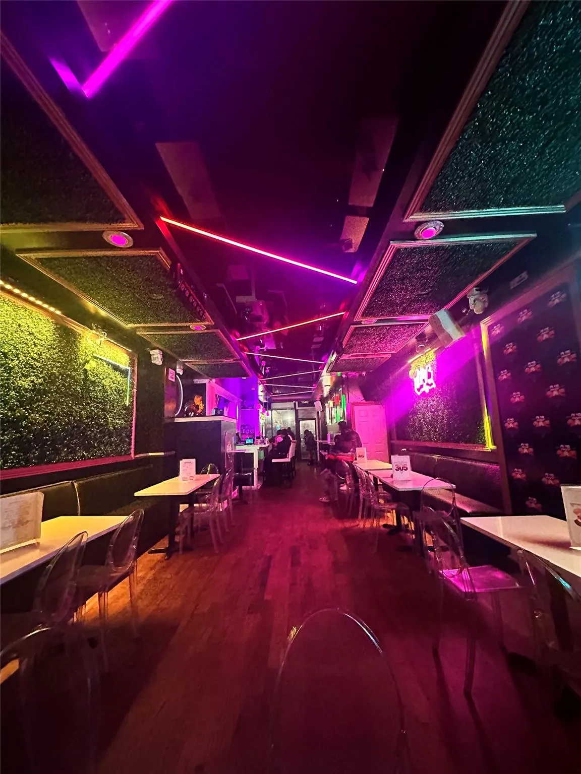 Recreation room with a desk and wood finished floors Recreation room with a desk and wood finished floors