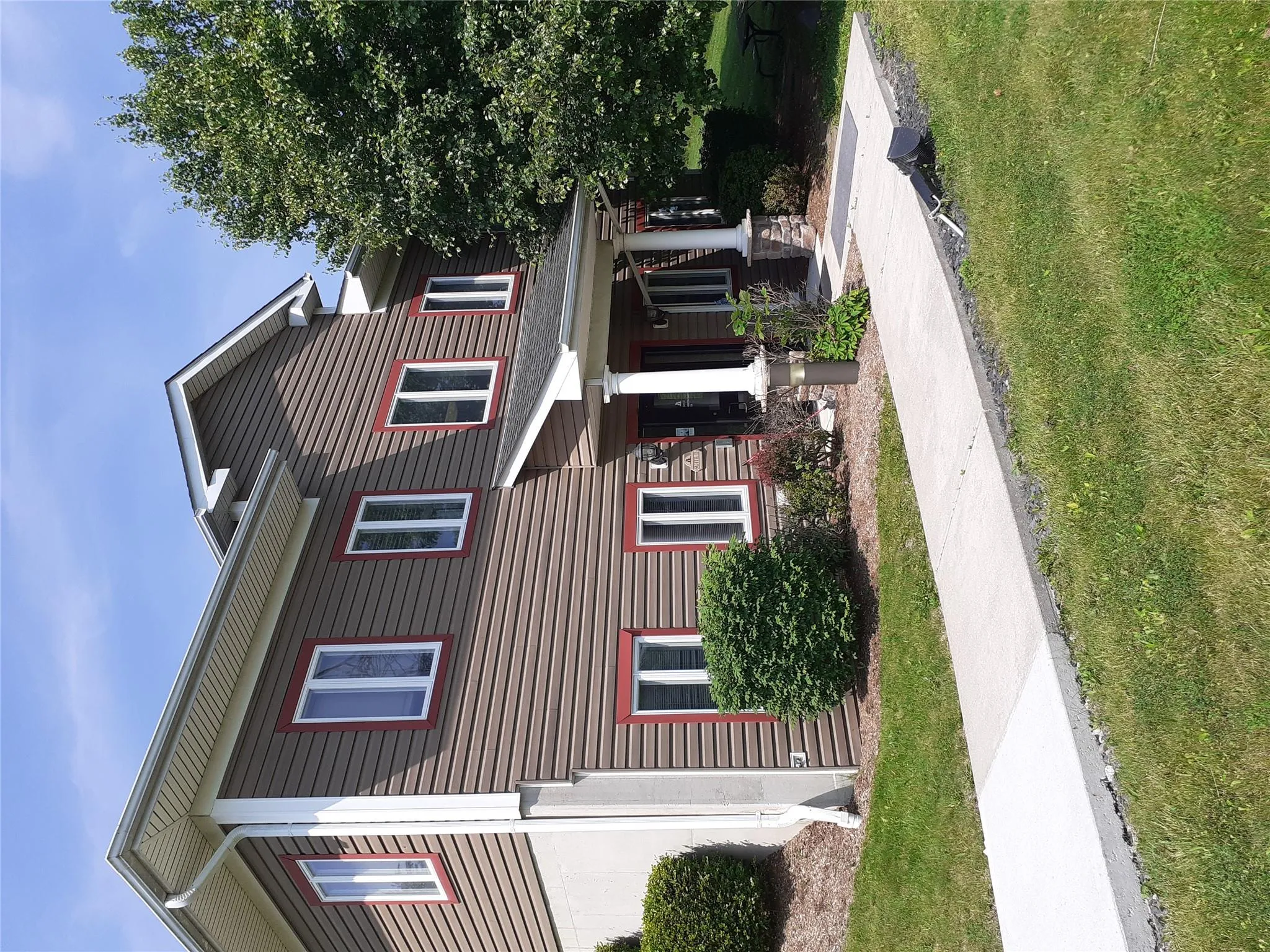 View of front of property featuring a front yard and covered porch View of front of property featuring a front yard and covered porch