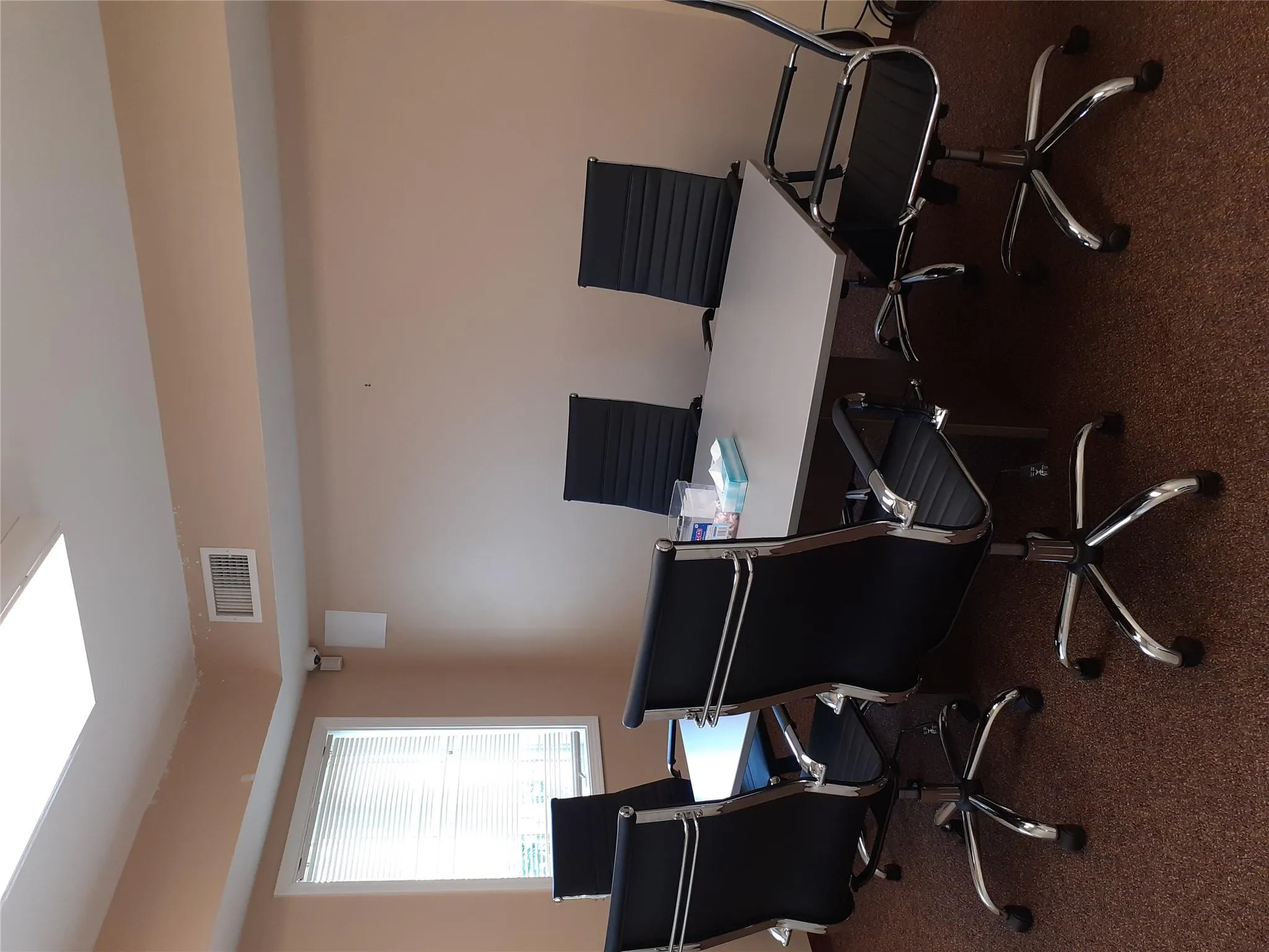 Office space featuring dark carpet Office space featuring dark carpet