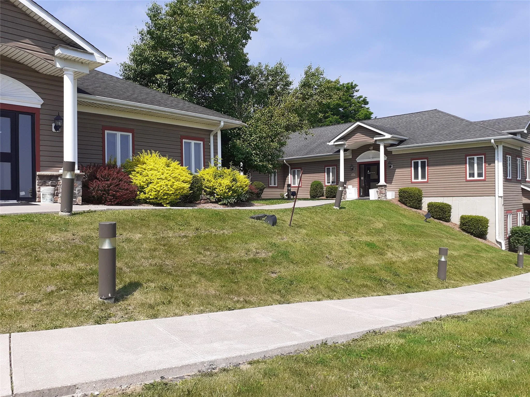 View of front of house featuring a front yard and a shingled roof View of front of house featuring a front yard and a shingled roof