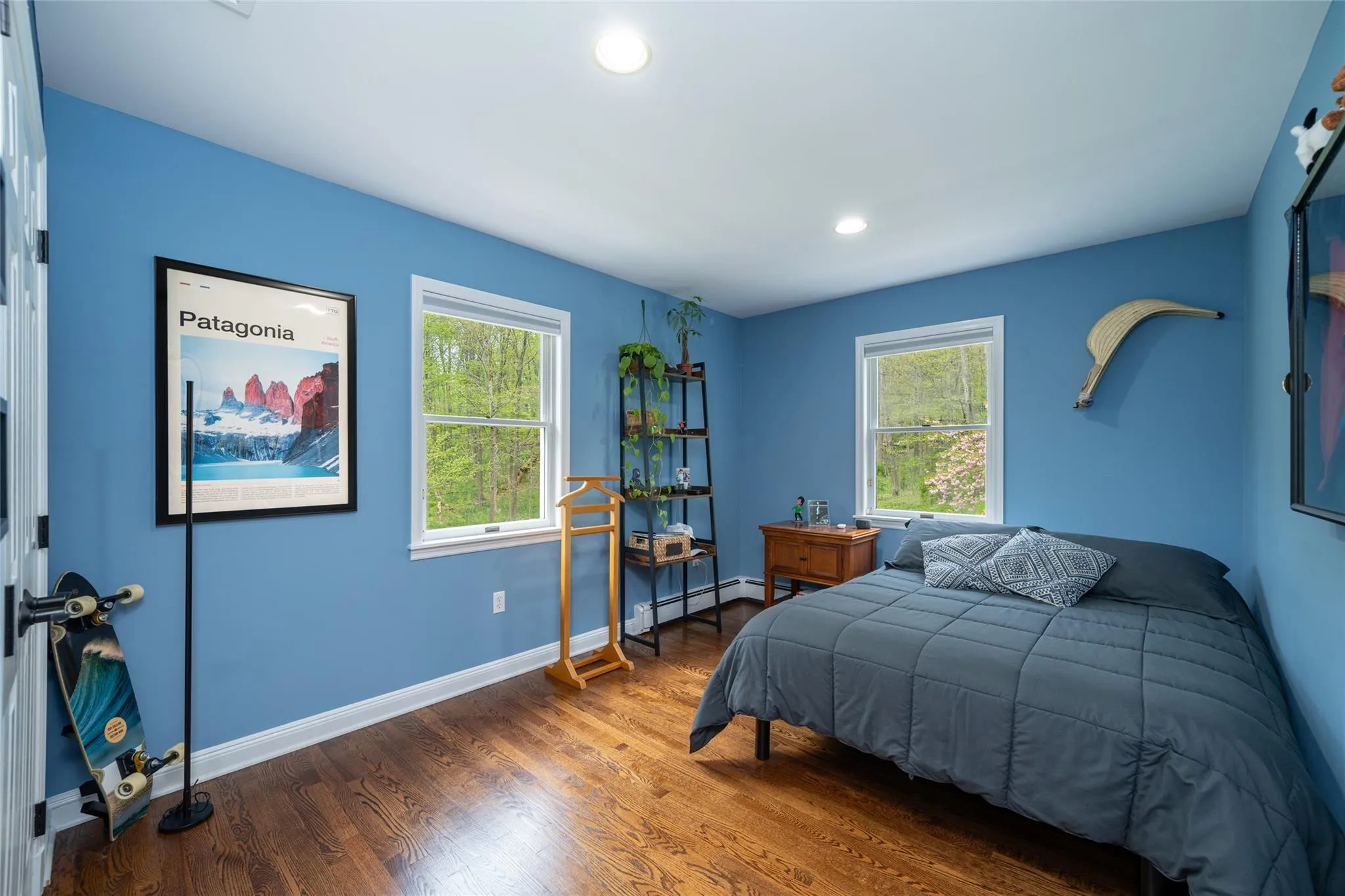 Bedroom featuring multiple windows,  wood finished floors, and recessed lighting Bedroom featuring multiple windows,  wood finished floors, and recessed lighting