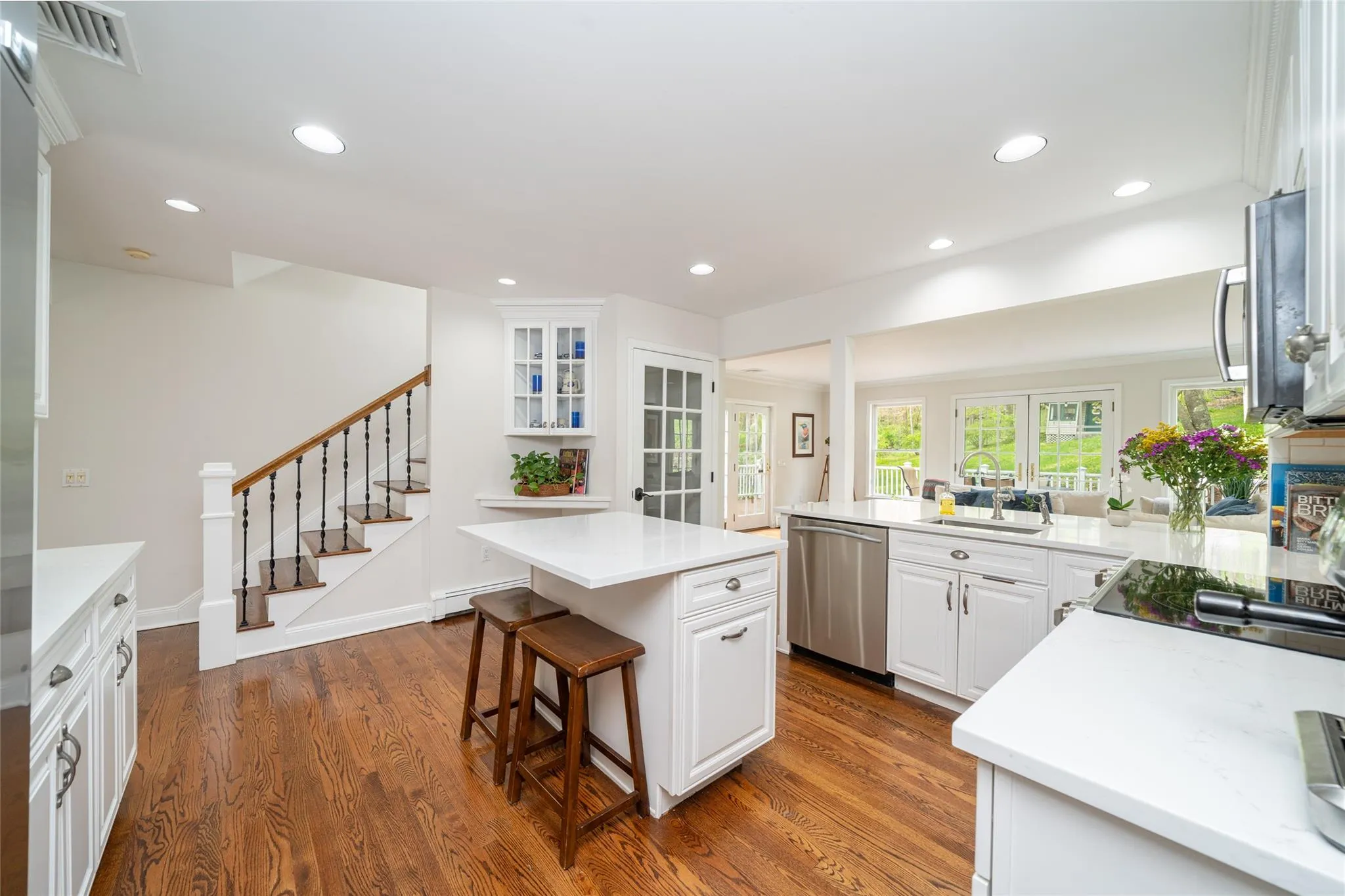 Recently renovated kitchen with open floor plan to the family room.  Quartz countertops and stainless steel appliances Recently renovated kitchen with open floor plan to the family room.  Quartz countertops and stainless steel appliances