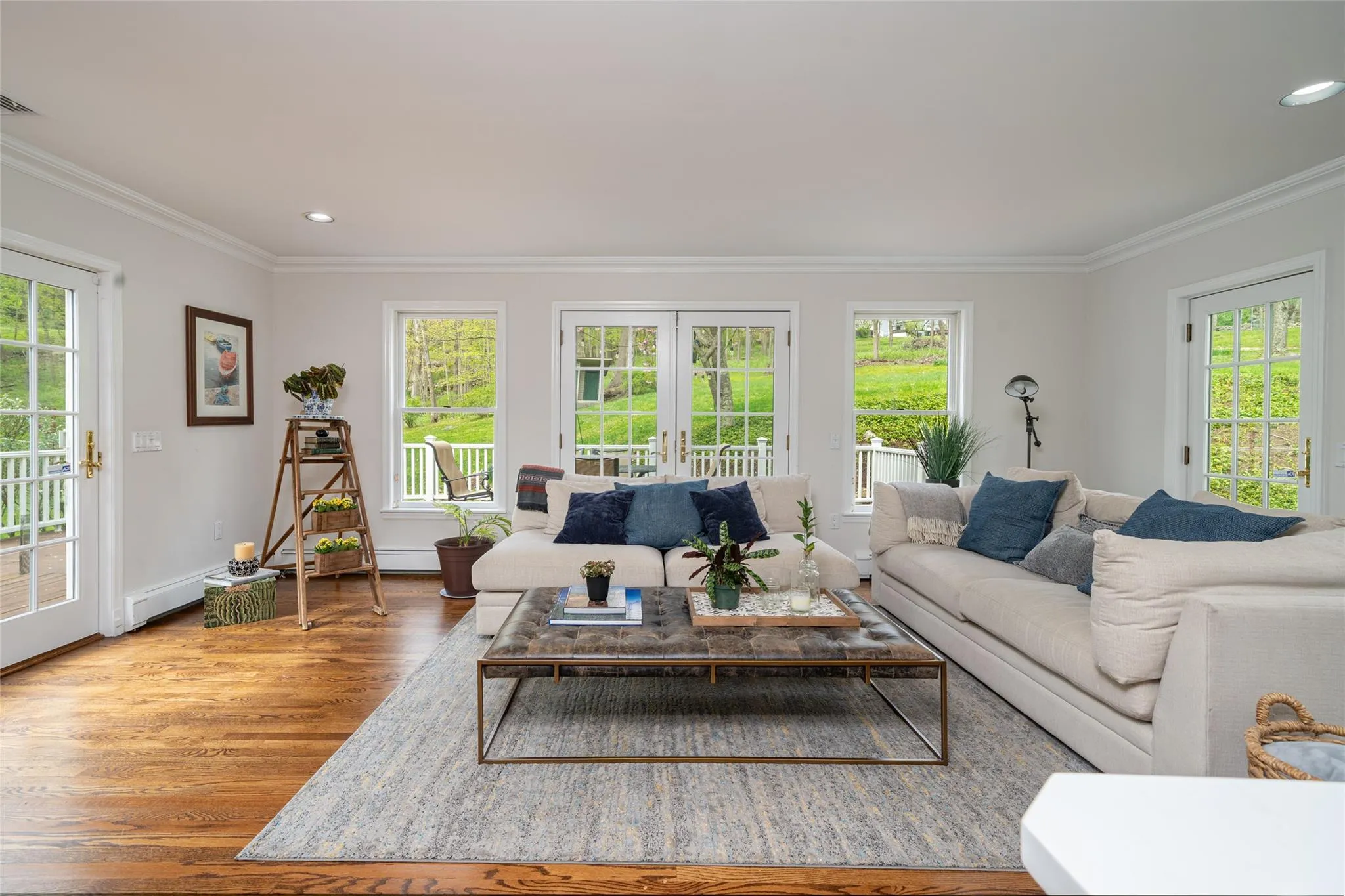 Sunny comfortable family room with doors out to the deck. Sunny comfortable family room with doors out to the deck.
