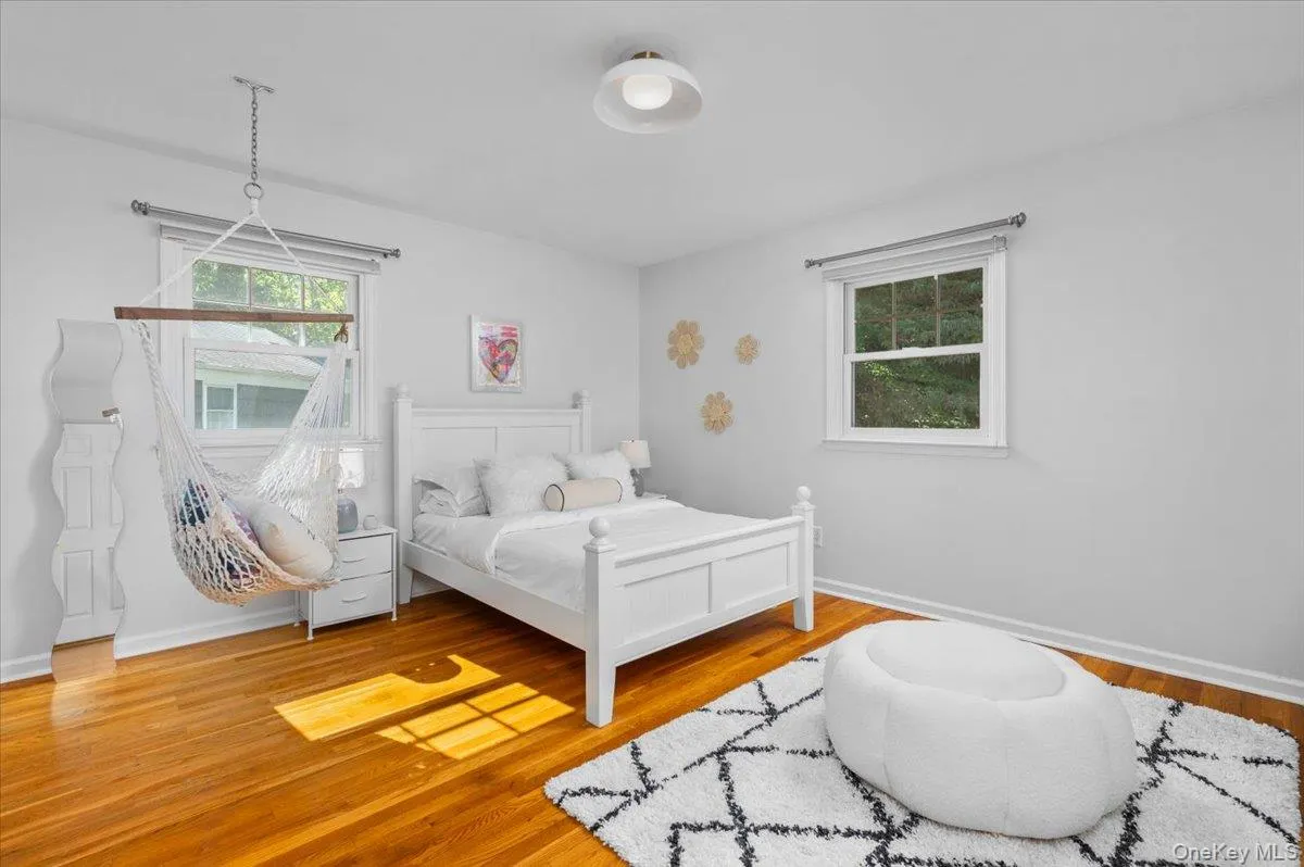 Bright and generously proportioned, this bedroom features hardwood floors, windows on two exposures and ample space for multiple furniture zones. Bright and generously proportioned, this bedroom features hardwood floors, windows on two exposures and ample space for multiple furniture zones.