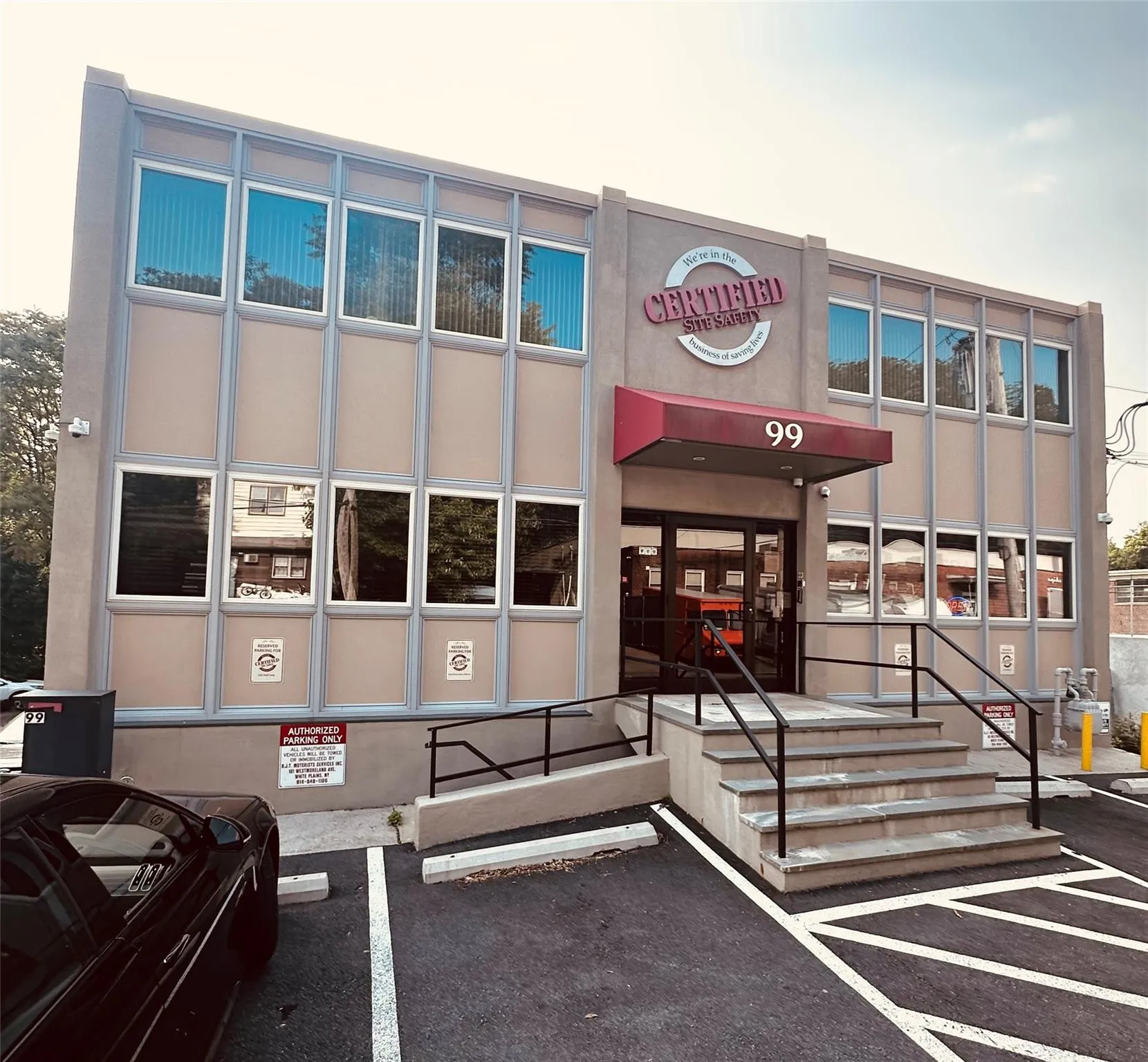 View of property featuring uncovered parking View of property featuring uncovered parking