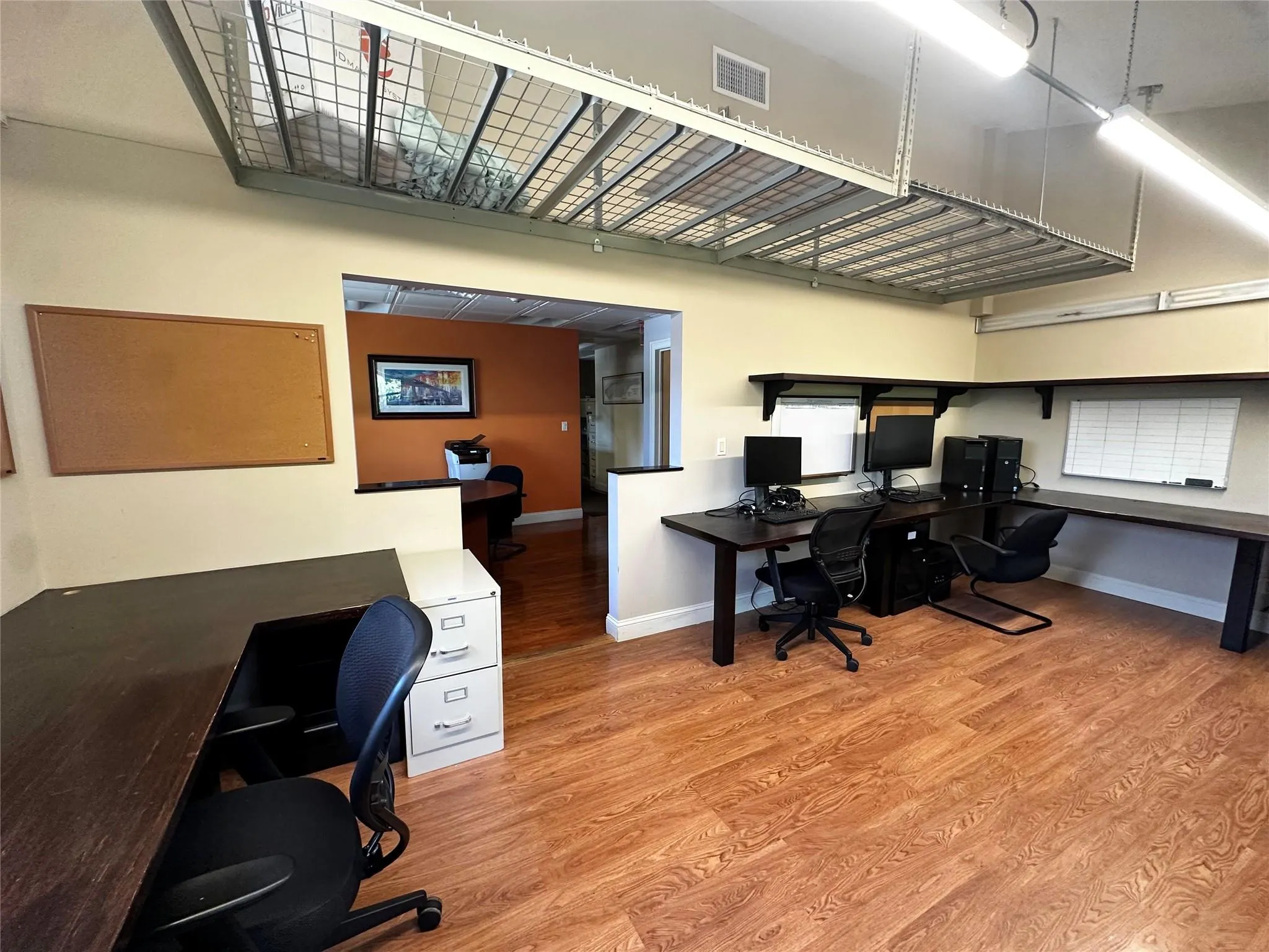 Office area featuring wood finished floors and baseboards Office area featuring wood finished floors and baseboards