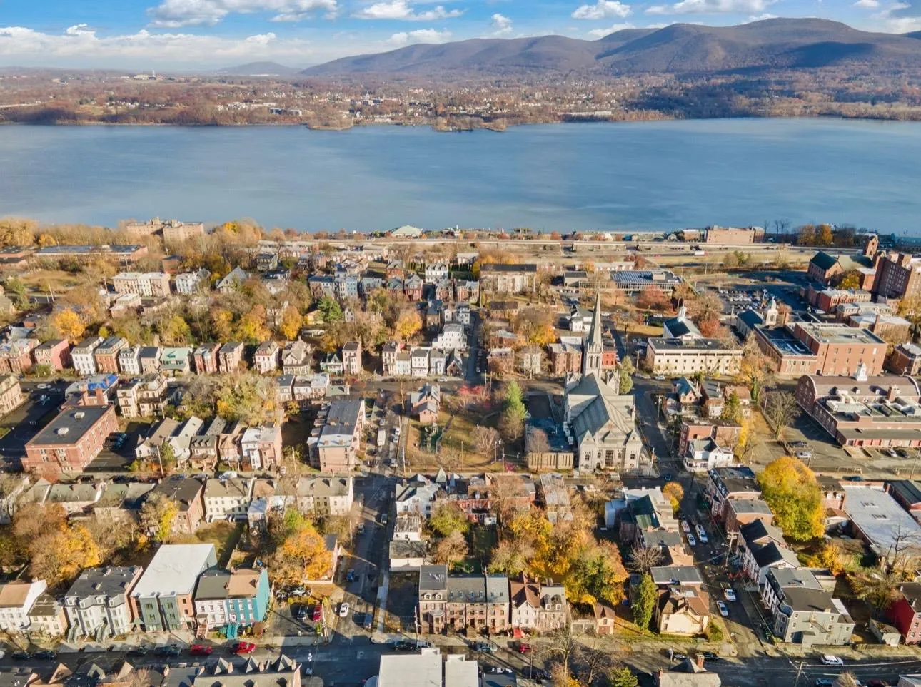 Aerial view featuring a water and mountain view Aerial view featuring a water and mountain view
