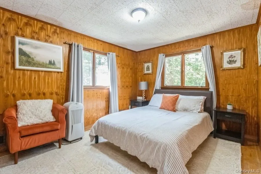 Bedroom with wood walls Bedroom with wood walls