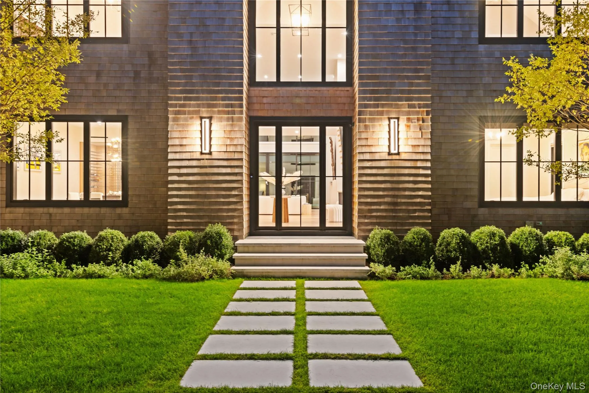 View of exterior entry with a yard View of exterior entry with a yard