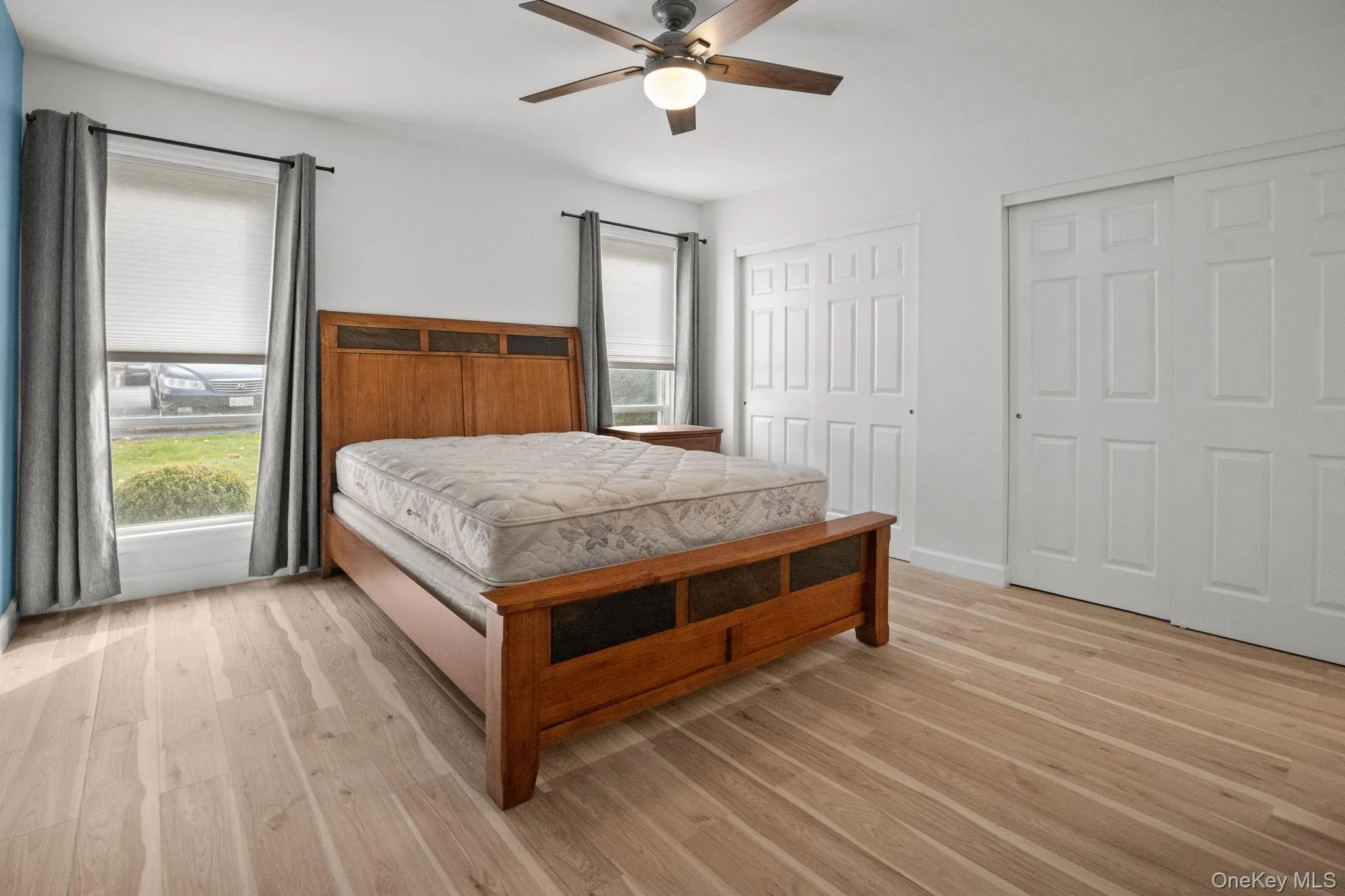 The spacious primary bedroom features new flooring, fresh paint, and abundant natural light creating a serene retreat. The spacious primary bedroom features new flooring, fresh paint, and abundant natural light creating a serene retreat.