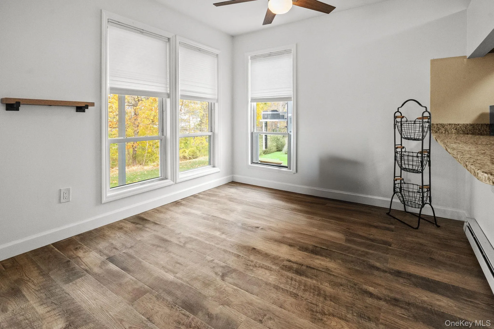 The dining area offers serene wooded views and effortless flow to the kitchen and outdoor deck. The dining area offers serene wooded views and effortless flow to the kitchen and outdoor deck.
