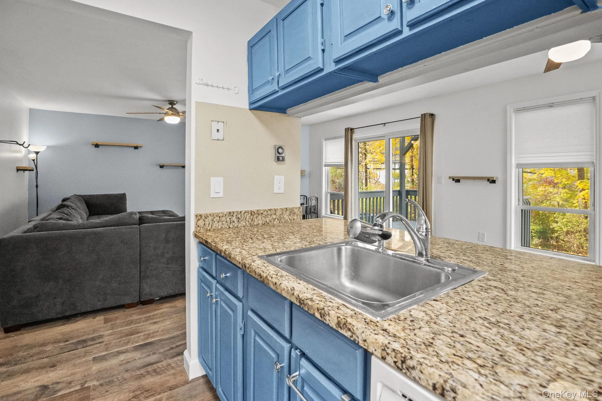 A wide pass-through opens the kitchen to the living area, creating a seamless connection for cooking and entertaining. A wide pass-through opens the kitchen to the living area, creating a seamless connection for cooking and entertaining.