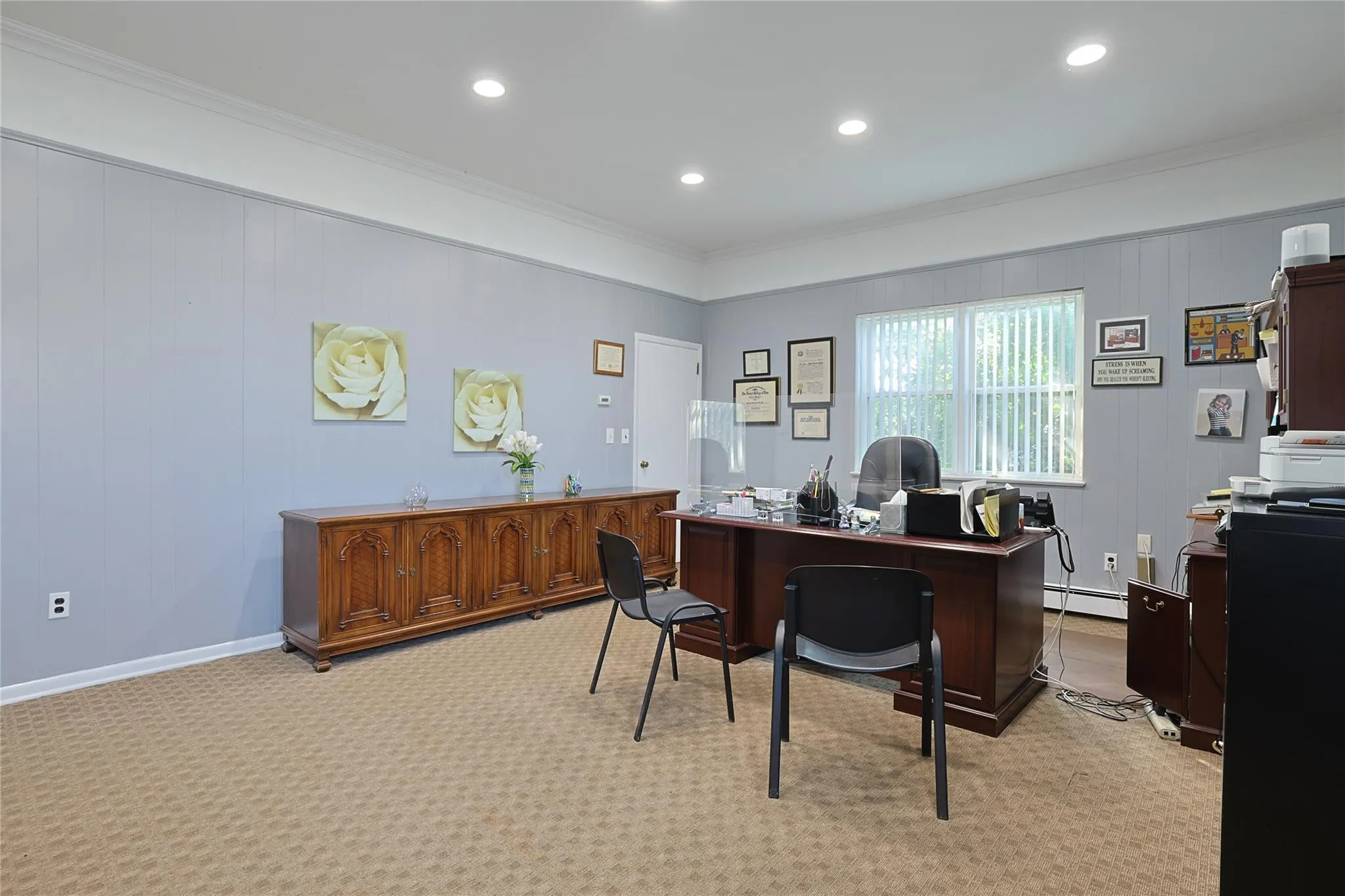Office space featuring baseboard heating, crown molding, recessed lighting, and light colored carpet Office space featuring baseboard heating, crown molding, recessed lighting, and light colored carpet